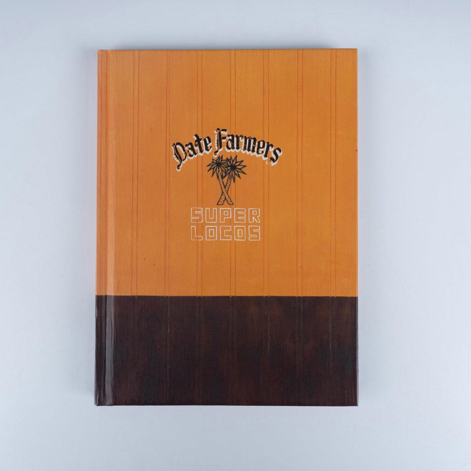 Signed Date Farmers Hardcover Book, Super Locos: San Francisco: Upper Playground, 2007. This fantastic book showcases artworks from Date Farmers, the collaborative duo of Armando Lerma and Carlos Ramirez, known for their vibrant mixed-media works th