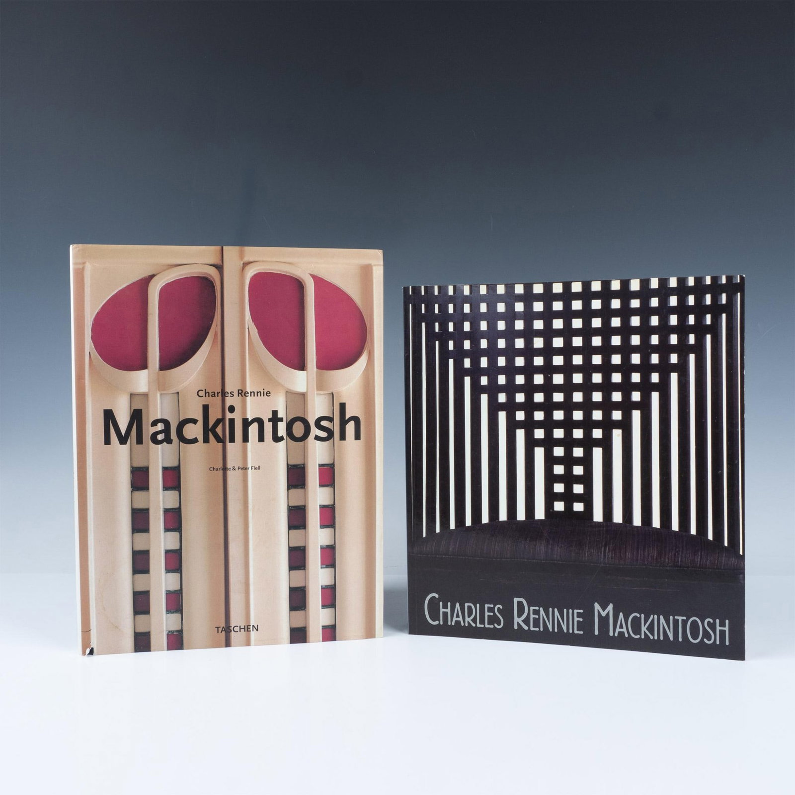 Set of 2 Charles Rennie Mackintosh Books: Titles includes: Charles Rennie Mackintosh (1868-1928) by Charlotte Fiell and Peter Fiell (1996); Charles Rennie Mackintosh edited by Wendy Kaplan (1996). The dimensions of the collection measures: 10
