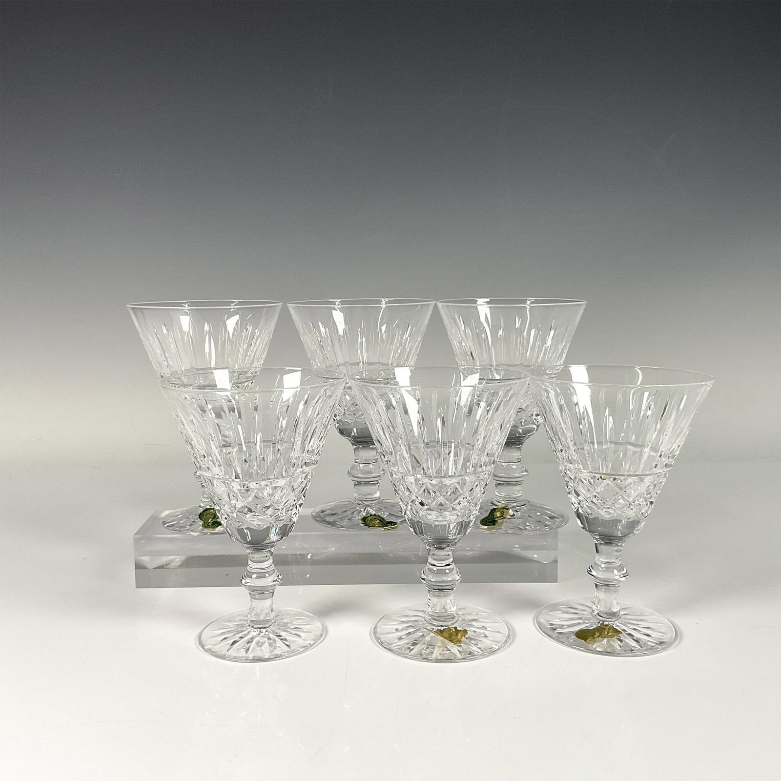 6pc Waterford Crystal White Wine Set, Tramore: Stunning set of six Waterford Crystal in Tramore pattern. White wine glasses, featuring a beautiful combination of cut lines and diamond patterned crystal detailing. Waterford marks and five of them h