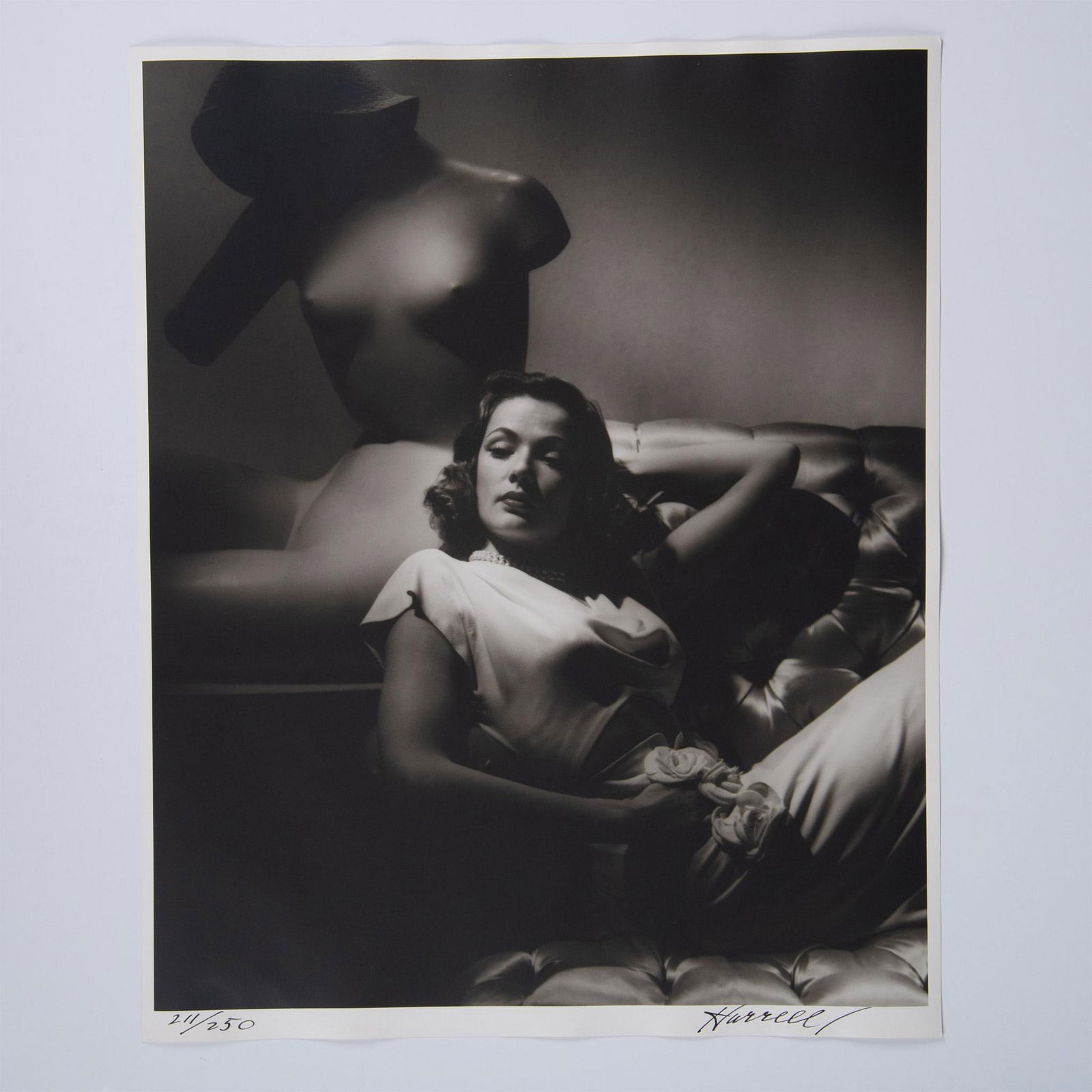 George Hurrell, Original Silver Gelatin Photograph, Signed: An exquisite original gelatin silver print on Portriga fiber paper featuring one of the most recognizable faces of studio-era Hollywood, Gene Tierney. Shot in 1944 by Golden Era photographer to the st