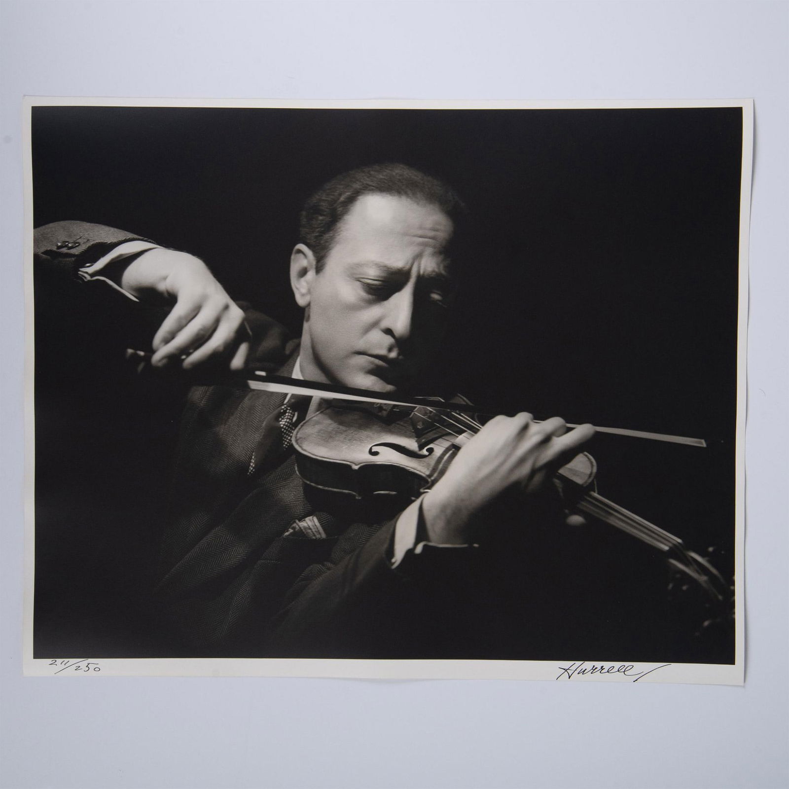 George Hurrell, Original Silver Gelatin Photograph, Signed: An exquisite original gelatin silver print on Portriga fiber paper featuring one of the greatest violinists of all time Jascha Heifetz. Shot in 1937 by Hollywood Golden Era photographer to the stars G