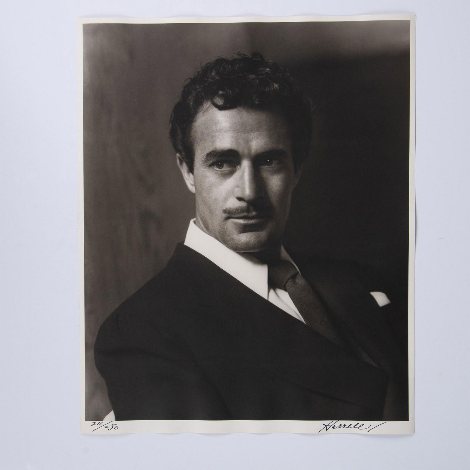 George Hurrell, Original Silver Gelatin Photograph, Signed: An exquisite original gelatin silver print on Portriga fiber paper featuring film and television actor Gilbert Roland. Shot in 1939 by Hollywood Golden Era photographer to the stars George Hurrell at