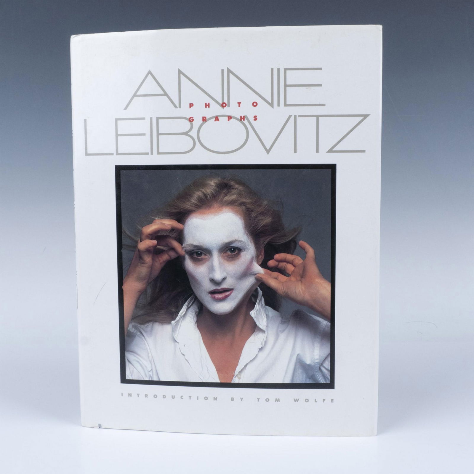 1st Edition Annie Leibovitz Book, Photographs: 144 page hardcover with original dustjacket. Brings together a collection of 70 photographs, including portraits of musicians, actors, and other personalities. ISBN: 9780394532080. Artist: Annie Leibo