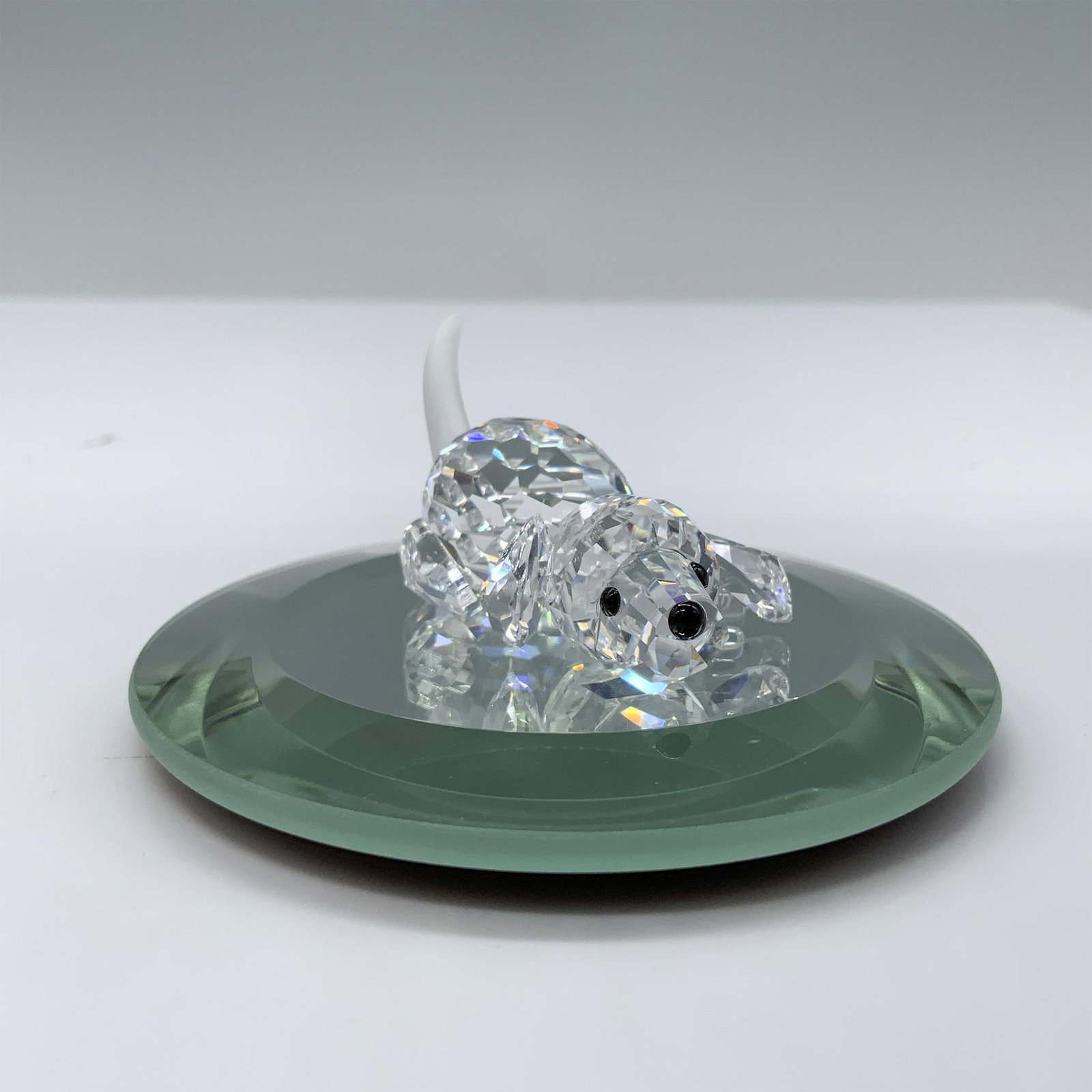 Swarovski Crystal Figurine, Beagle Puppy Playing: Part of the Peaceful Countryside theme group. An adorable clear crystal puppy in a prone position ready to play. Frosted tail, and black eyes and nose. Swarovski swan marked. This item has its origina