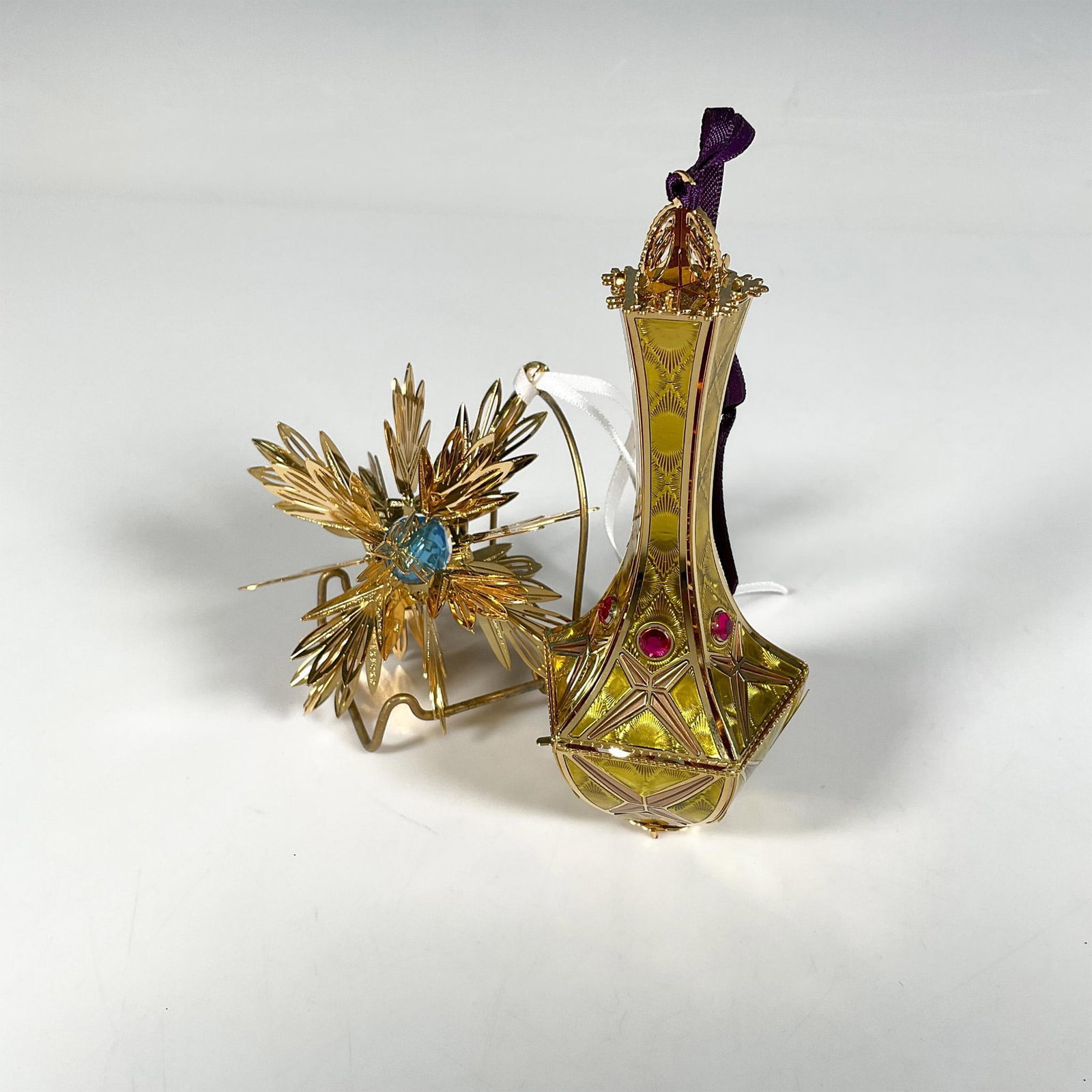 Waterford Gilded Ornaments, Holiday Heirlooms: Handcrafted pair of ornaments featuring the Imperial Kildare Drop, adorned with shining ruby gems that complement an intricate geometric pattern, alongside the Gold Snowflake, with a vibrant turquoise