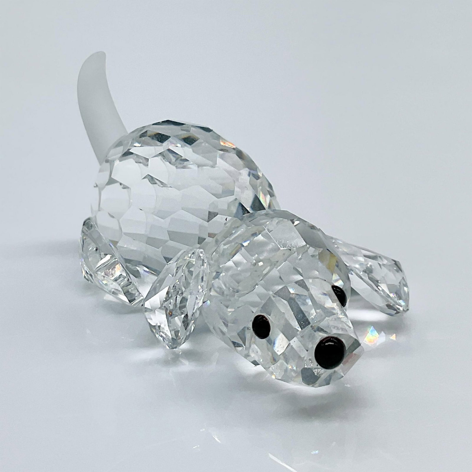 Swarovski Crystal Figurine, Beagle Puppy Playing: As a part of the Peaceful Countryside theme, this cute faceted clear crystal beagle has a frosted tail and black nose and eyes. This item has its original box measuring 3.25"L x 3.25"W x 2.5"H. Certif