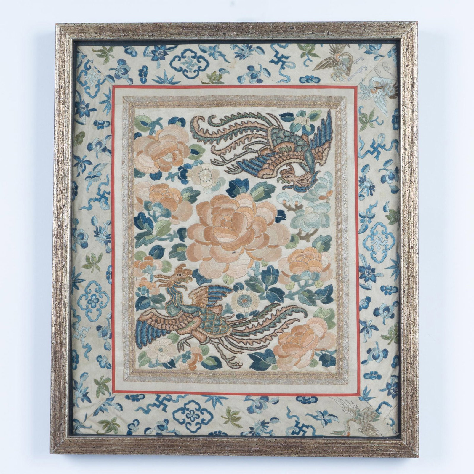 Antique Chinese Embroidery on Silk, Phoenix and Peonies: An exquisite antique silk panel, from the Daoguang period, beautifully embroidered with two phoenix birds in intricate Pekinese stitch, surrounded by peonies and adorned with a floral and avian border