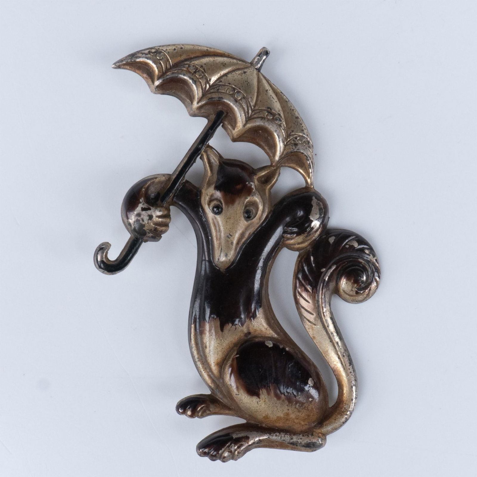 Coro Sterling Silver Umbrella Squirrel Brooch: Painted brooch depicting a squirrel holding an umbrella. It is marked Coro Sterling on the back. Dimensions: 2.5"L x 1.75"W