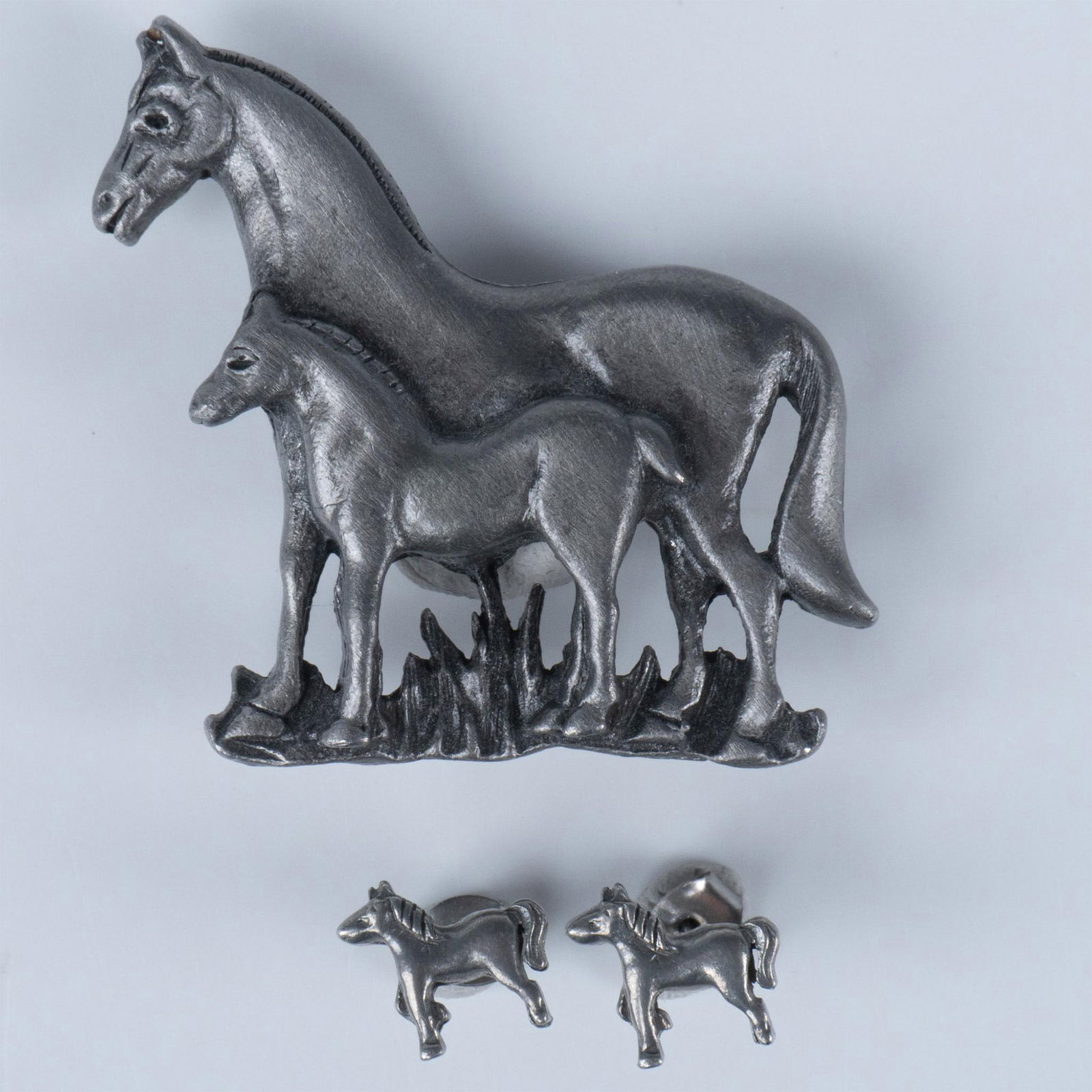 Pretty Horses Pewter Brooch and Earrings Set: Cute pewter mare and foal pin with matching stud earrings for pierced ears. The brooch measures approximately 1.5"L x 1.5"W. The earrings measure approximately 0.25"L x 0.45"W. Dimensions: See Descrip