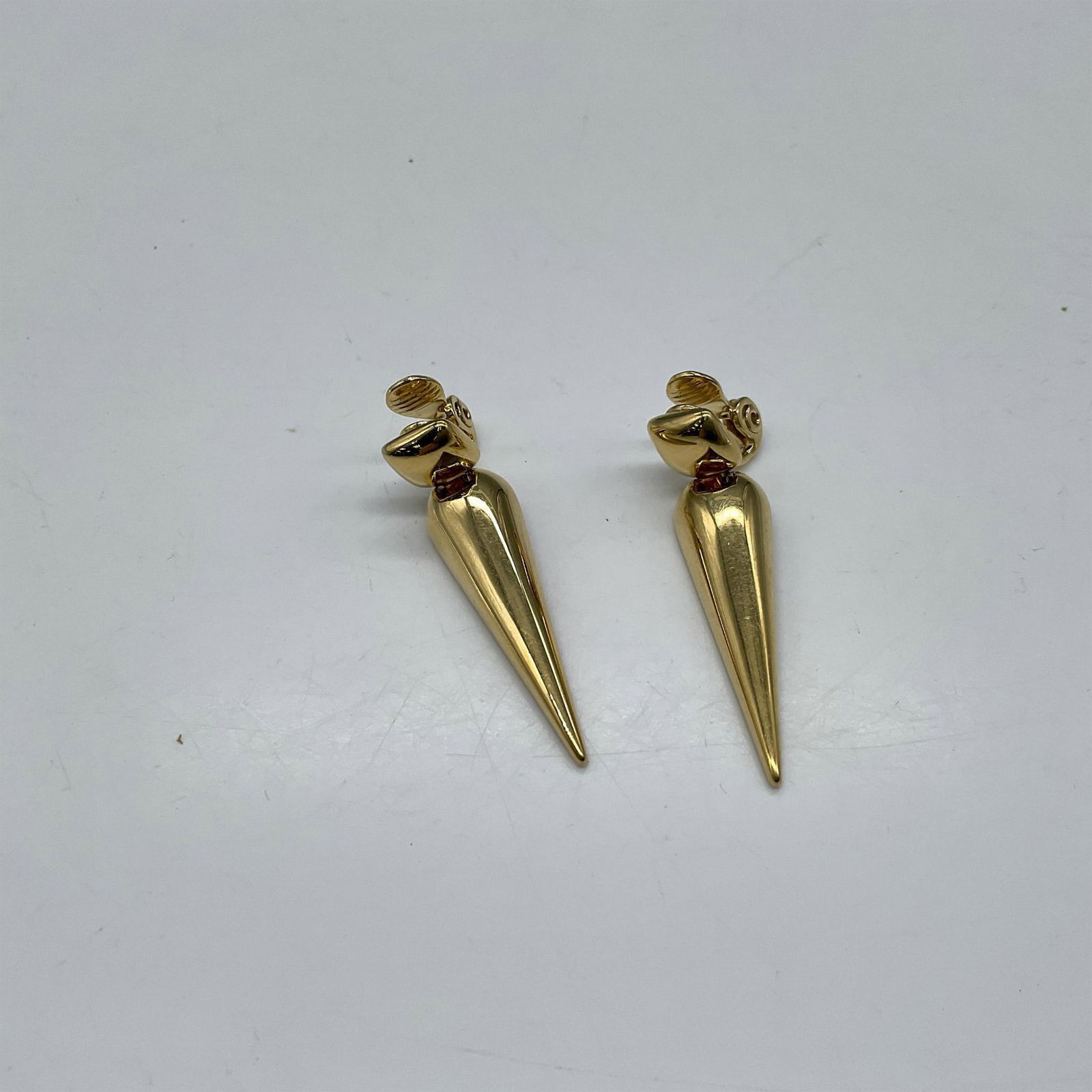 Monet Gold Tone Clip Earrings: Gold tone clip drop earrings - Monet impressed mark. Issued: c. 1970 Dimensions: 1.75"L Manufacturer: Monet