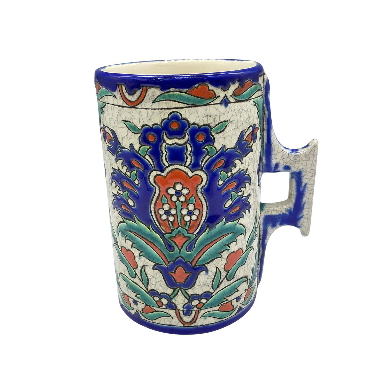 Boch Keramis by Charles Catteau Iznik Pattern Beaker, D. 69: A ceramic beaker with handle, in a floral arabesque pattern with a craquelure finish. Stunning hand painted colors of red, blue, green, and white. Keramis Made In Belgium backstamps. Marked with D. 69
