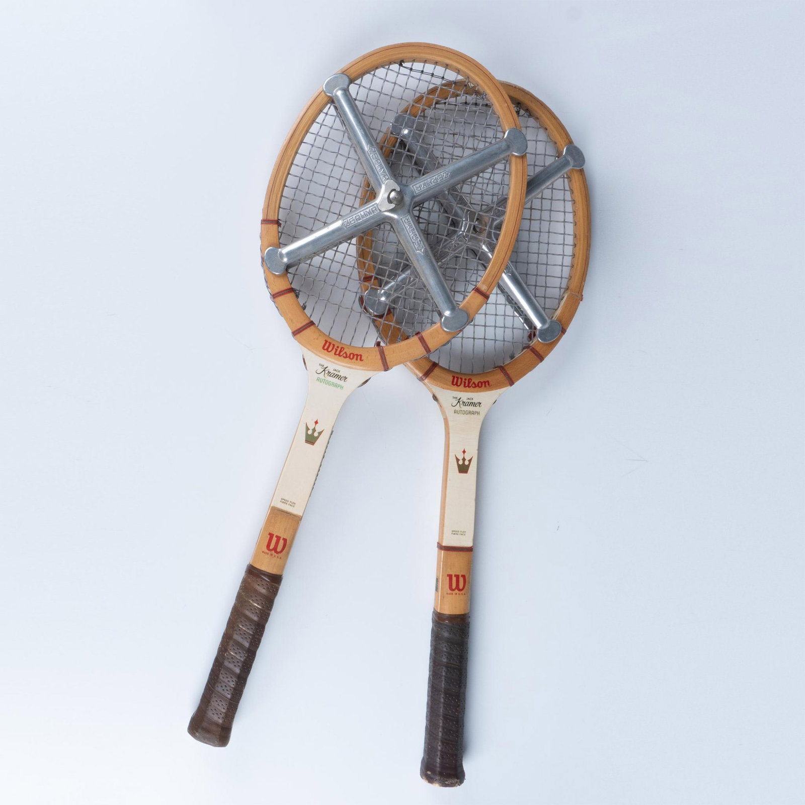 Pair of Wilson Kramer Autograph Wood Tennis Racquets: Original pair of 1960s Wilson Kramer Autograph wood tennis racquets with jackets. Speed flex fiber face. Each racquet dimensions with jacket: 9.25"L x 1.50"W x 27"H. Issued: c. 1960 Dimensions: See De
