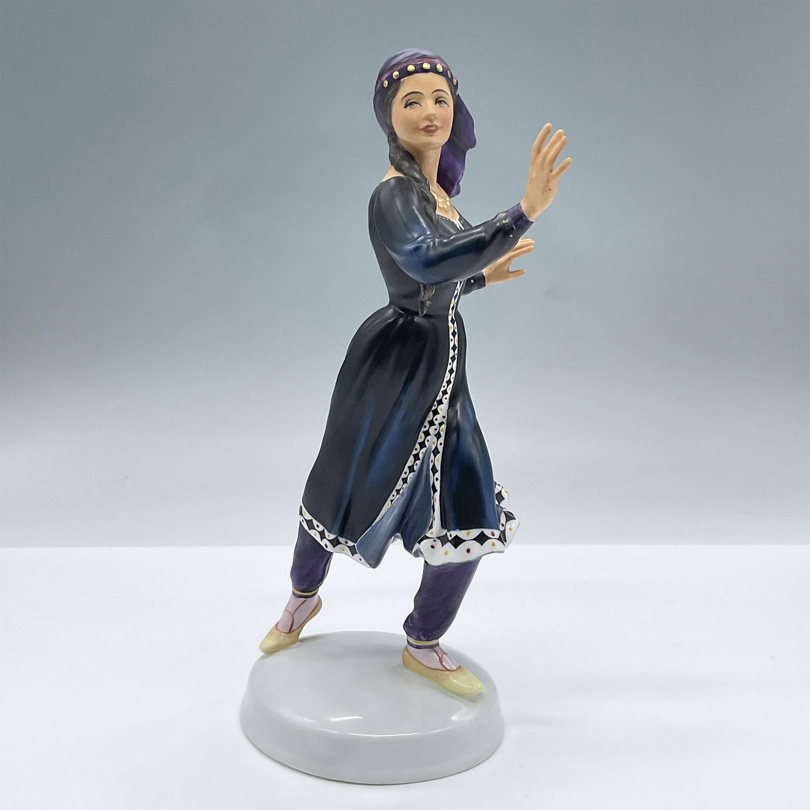 Kurdish Dancer - HN2867 - Royal Doulton Figurine: Matte finish. Limited edition. Royal Doulton backstamp. Artist: Peggy Davies Issued: 1979 Dimensions: 4.75"L x 3.25"W x 8.5"H Manufacturer: Royal Doulton Country of Origin: England