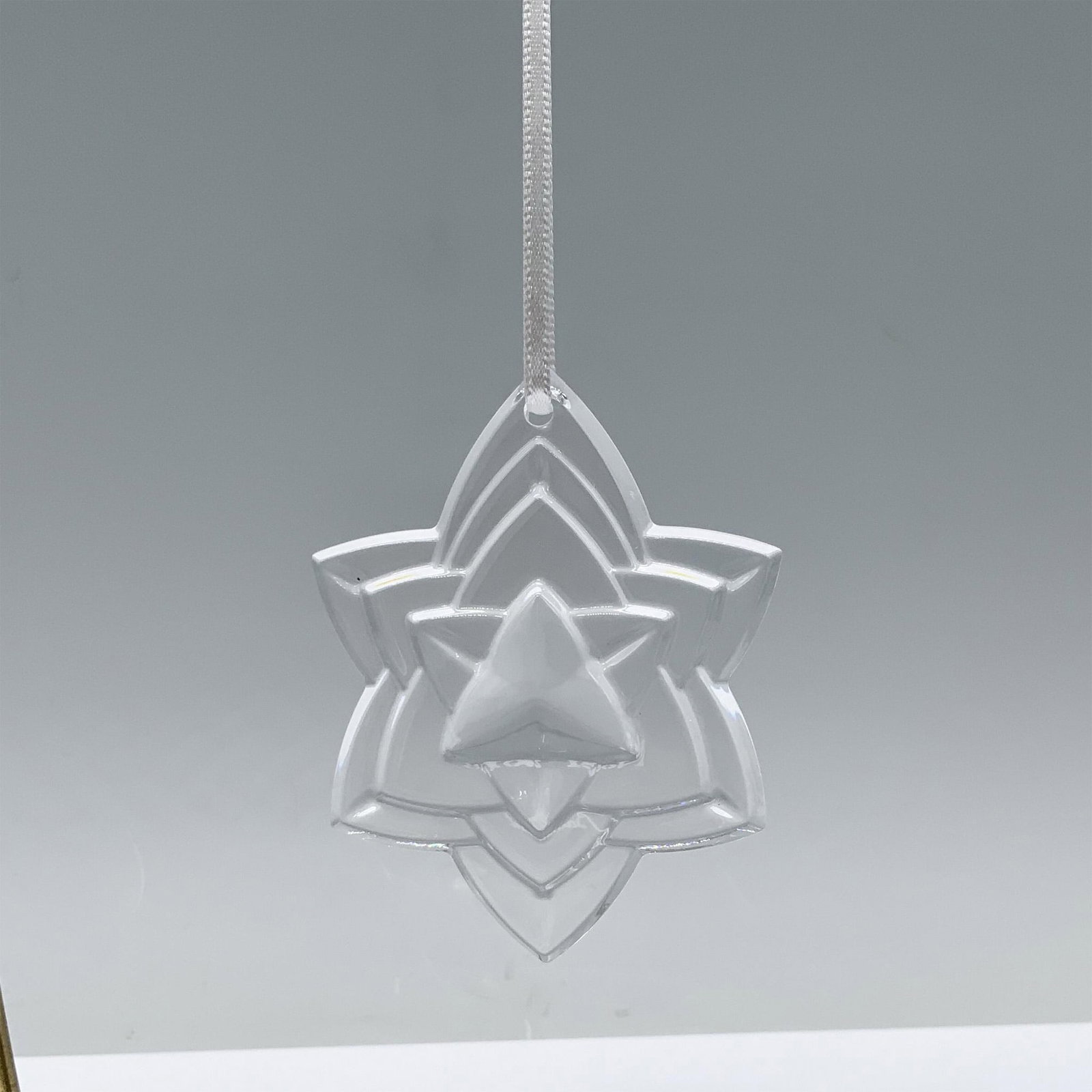 Baccarat Crystal Ornament, Clear Noel 2018: Annual edition crystal layered star shape, adding elegance and sparkle to holiday decor. Engraved with Noel 2018 Baccarat on the back. 2812248. This item has its original box. Box measures: 4"L x 3.25