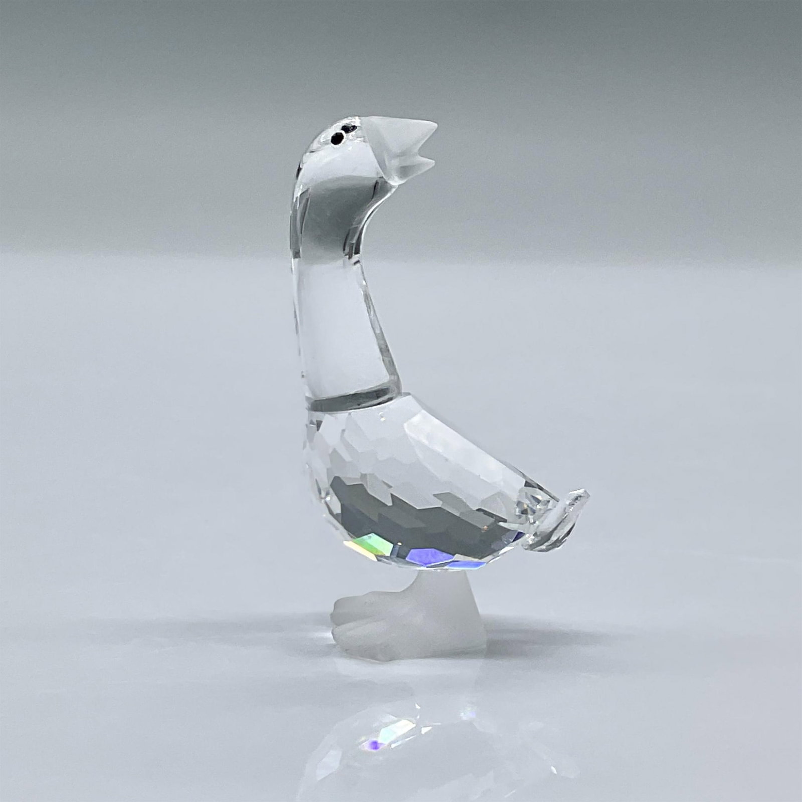 Swarovski Crystal Figurine, Gosling Dick: This figure is made from clear facetted crystal, it has black eyes with a frosted beak and frosted feet. This item has its original box measuring 3.25"L x 3.25"W x 2.5"H. Swarovski acid mark. 174963. 