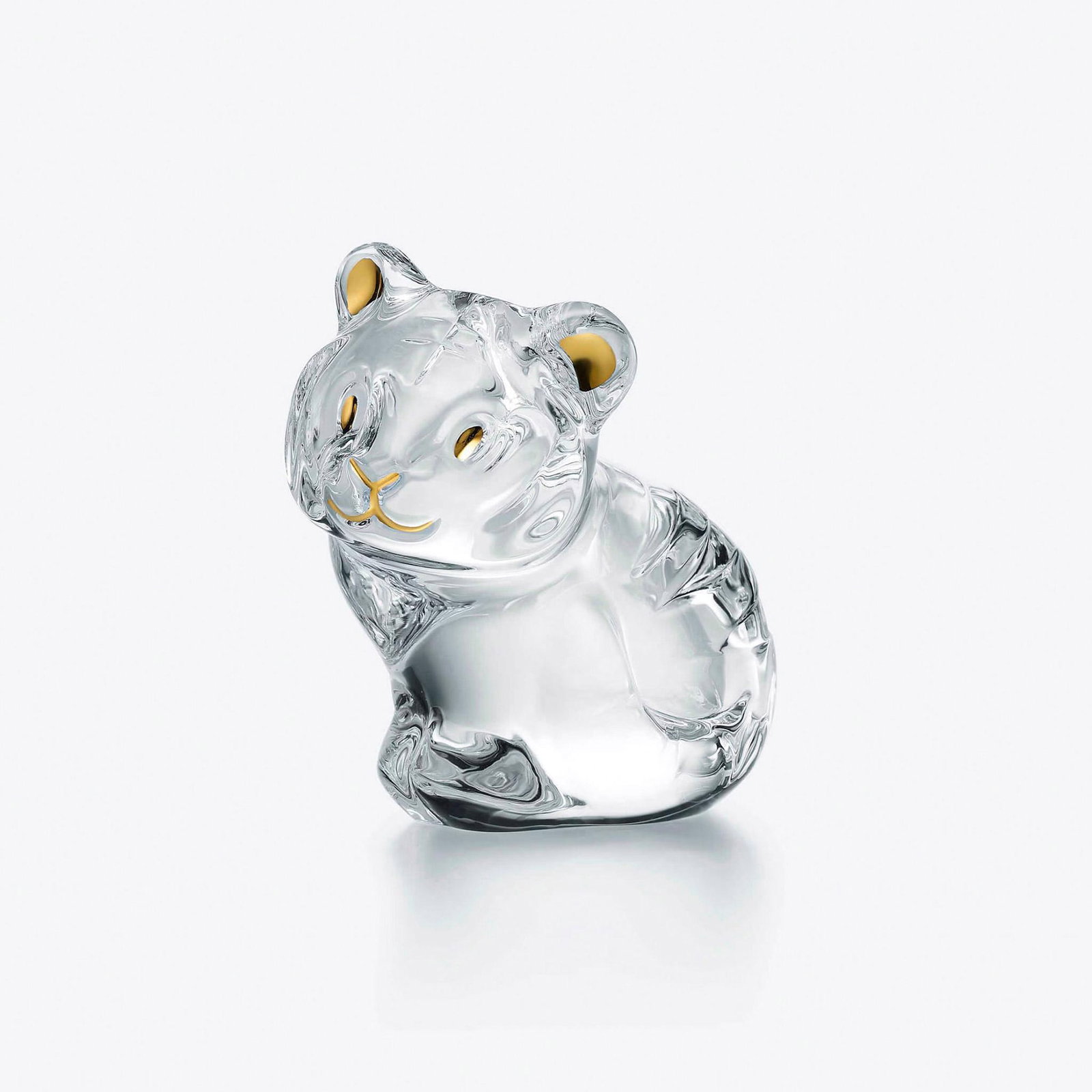 Baccarat Crystal Figurine, Minimals Tiger, Sealed Box: Charming crystal tiger figurine with delicate golden accents on the ears, eyes, and nose, capturing a playful and adorable expression. 2814560. This item has its original box. Box measures: 4.75"L x 4