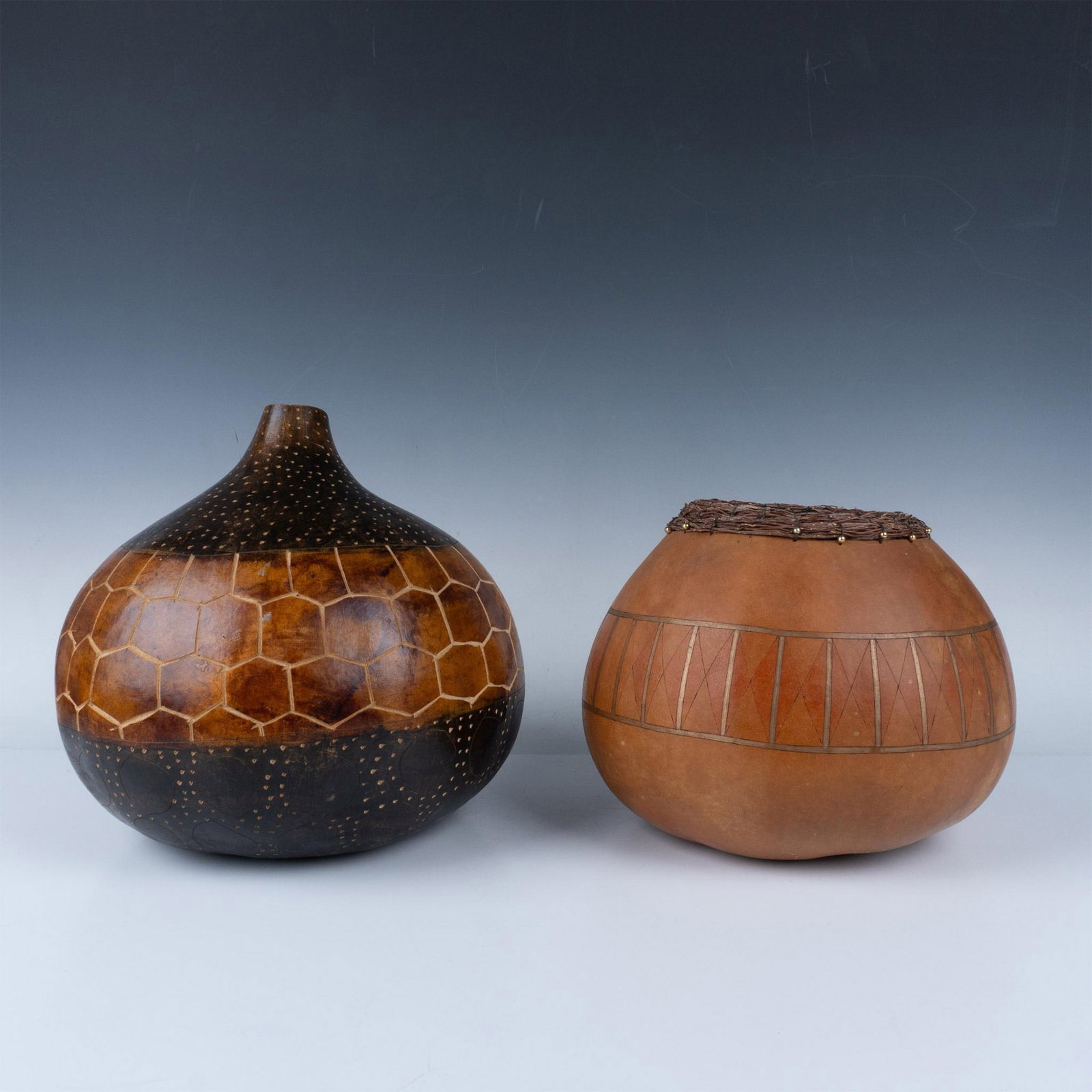2pc Margo Annis Fiber Art, Decorative Gourds: Hand crafted, designed and painted by artist bringing out the natural beauty of each gourd. Funnel gourd measures 10.5"H x 10.5" dia. and bulb gourd with twig neck design measures 8"H x 8.5" dia. Marg