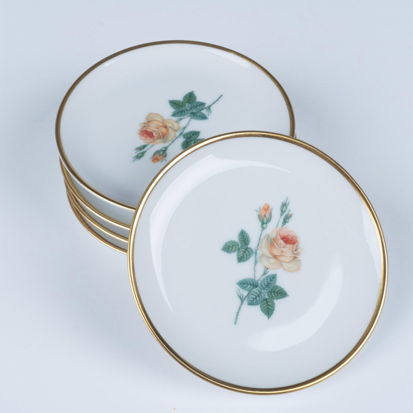 Set of 5 Alba-Kunst Alboth & Kaiser Rose Plates: This set includes five lovely small plates featuring a rose in the center and embellished with a gilt rim. Alba-Kunst Alboth and Kaiser Bavaria backstamp. Issued: c. 1960 Dimensions: 4" dia. Manufactu