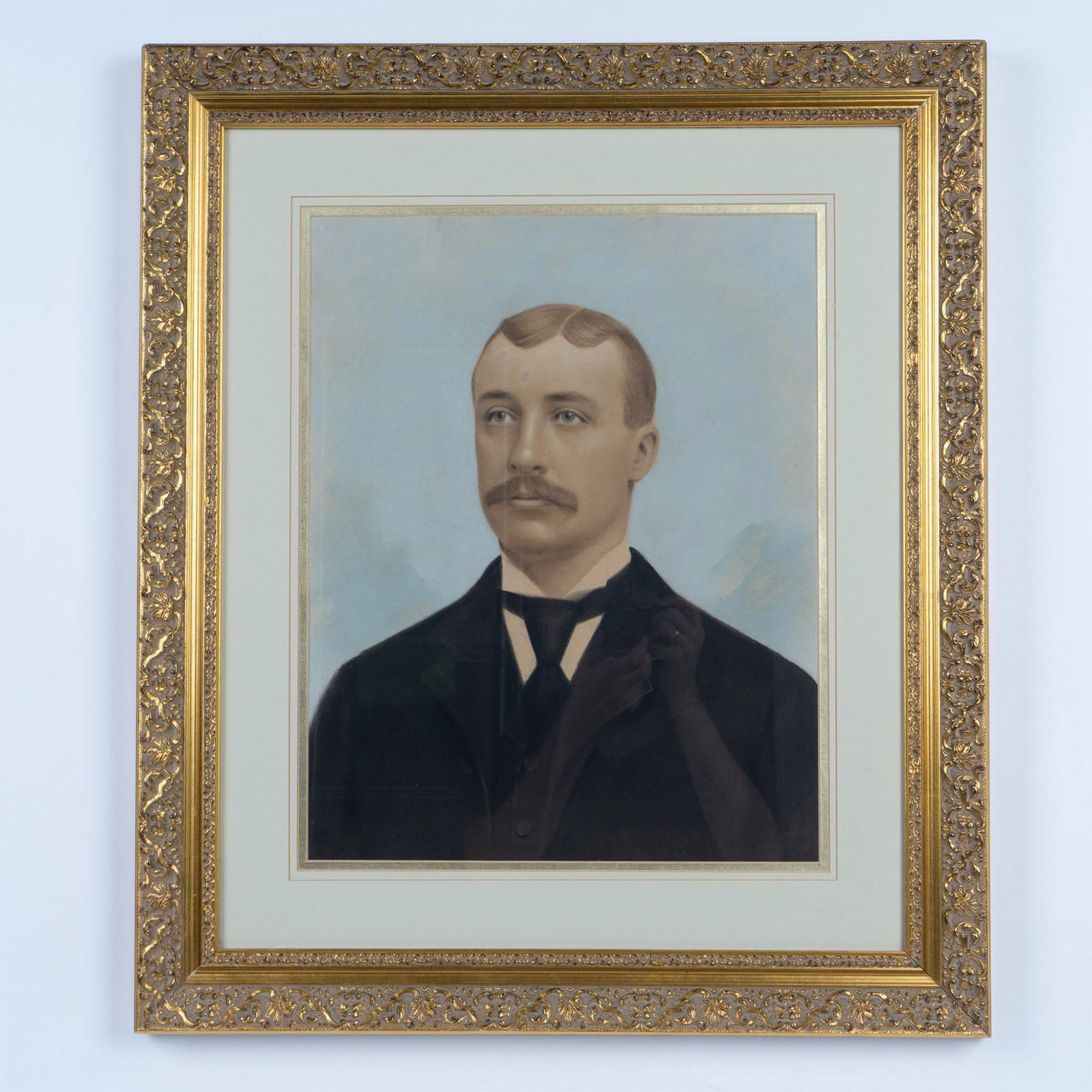Antique Original Pastel on Board, Portrait of a Gentleman: Large antique original pastel on paper board featuring the handsome portrait of a gentleman dressed in a black suit. No apparent signature. Housed in a gilded frame with an off-white mat. Artwork dime