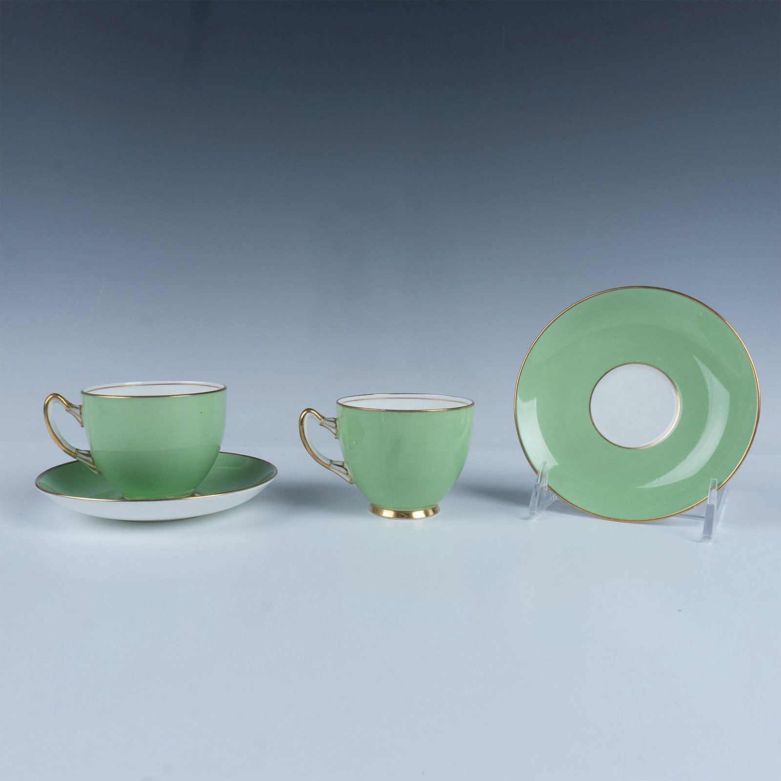 4pc Adderley Bone China Cups and Saucers: An elegant pair of cups and saucers in mint green with gold around the rims and on the handles. Adderley backstamps. Dimensions: See Description Manufacturer: Adderley Country of Origin: England
