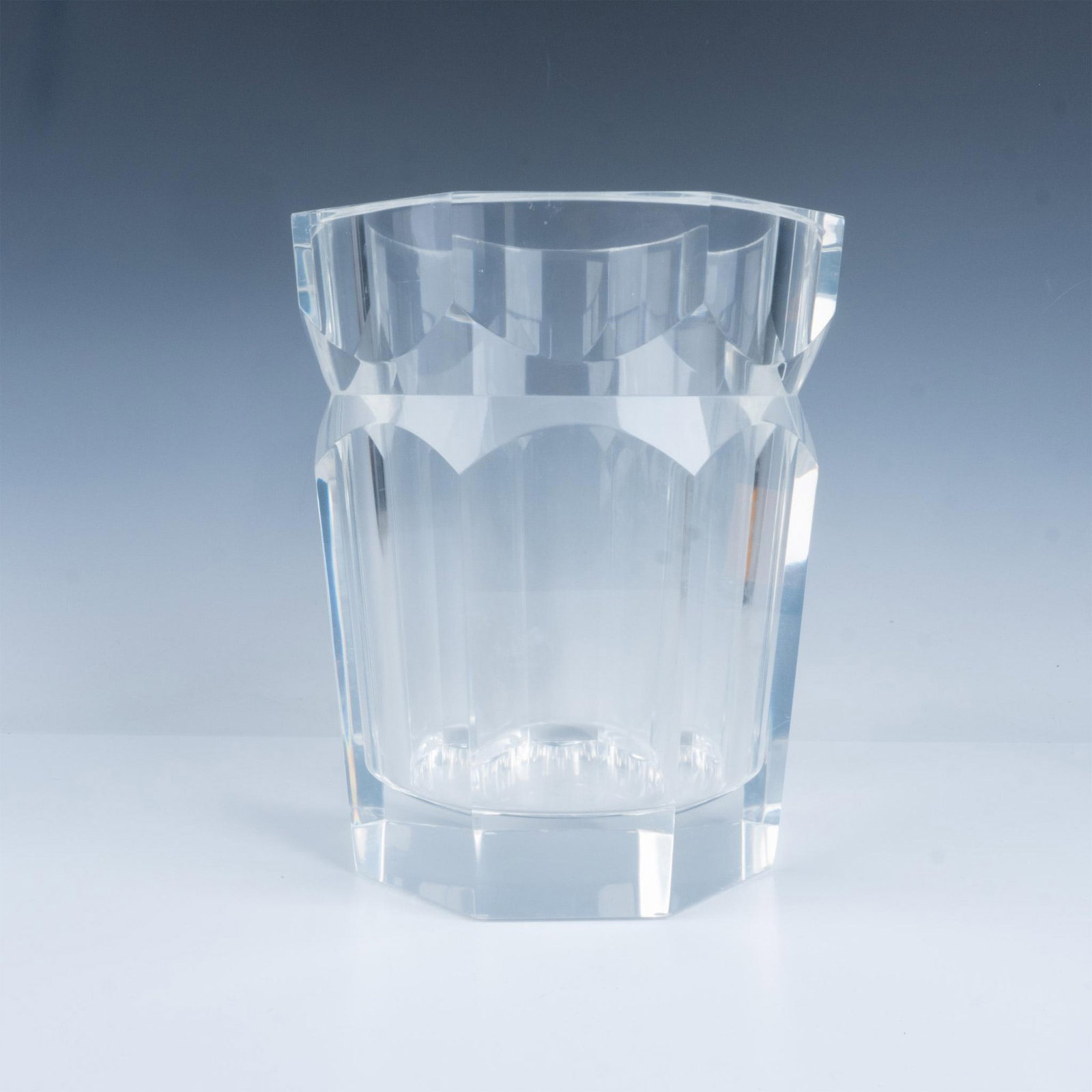 Vintage Lucite Ice Bucket: A large faceted thick ice bucket with indented neck. Issued: 20th century Dimensions: 8.5"dia x 10"H