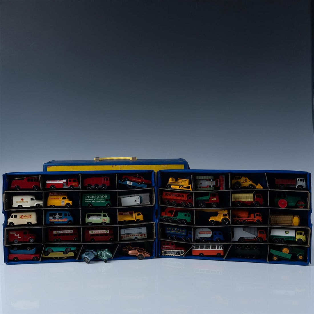 Vintage Matchbox Cars With Carrying Case: This extremely rare set features 44 die-cast metal Matchbox cars from the 1960's, neatly arranged in their original display trays. The trays pull out of the carrying case, allowing for easy play or di