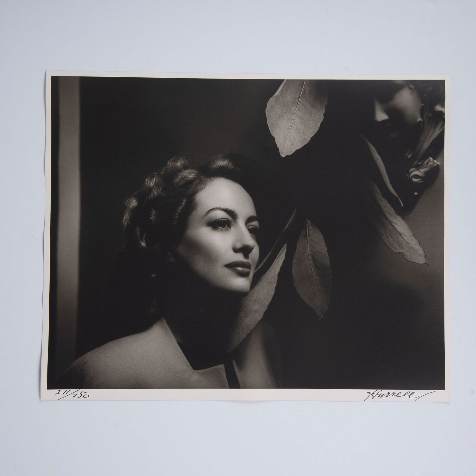 George Hurrell, Original Silver Gelatin Photograph of Joan Crawford, Signed: An exquisite original gelatin silver print on Portriga fiber paper by legendary photographer George Hurrell, featuring Hollywood icon Joan Crawford. This photograph, taken in 1941 at Joan Crawford's h