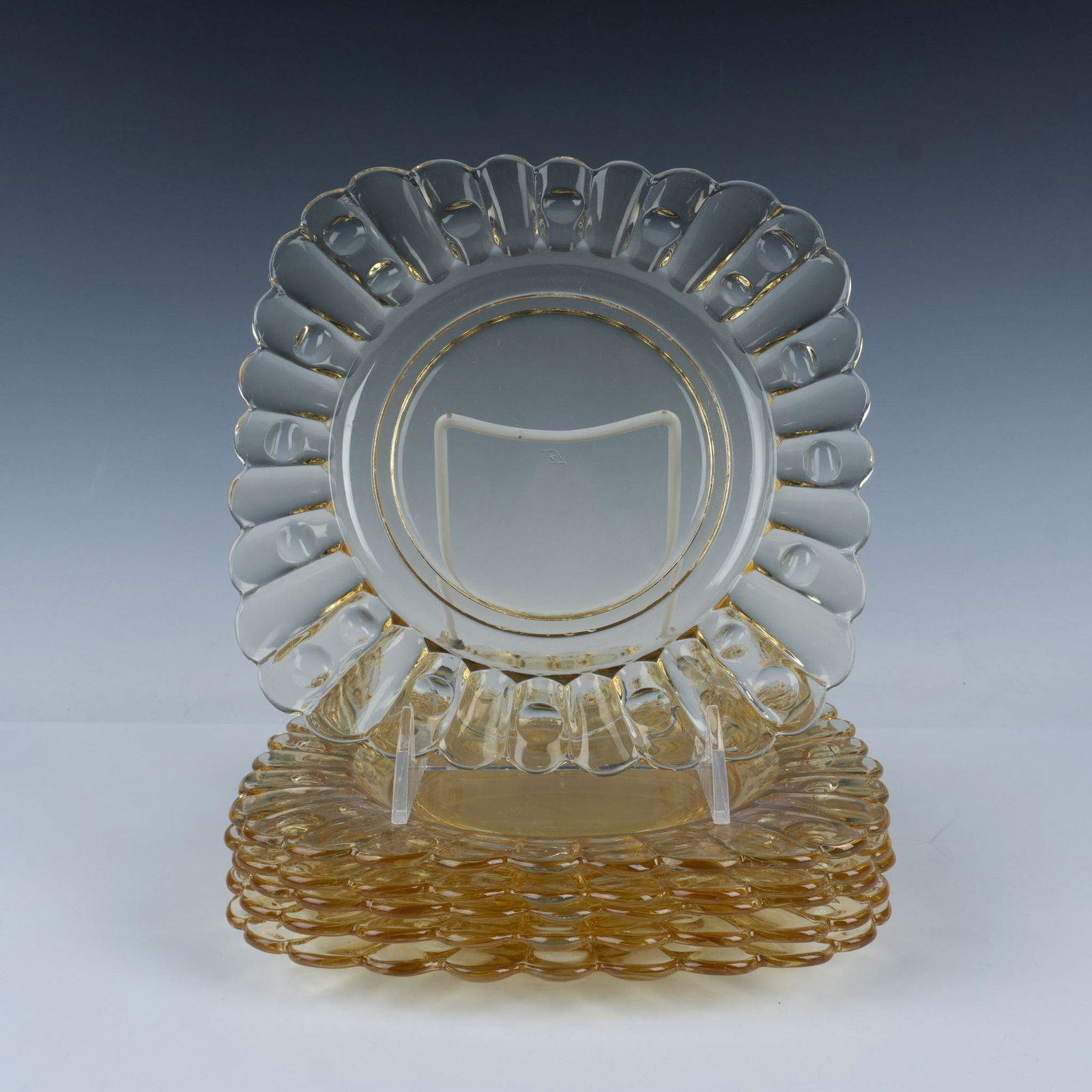 6pc Heisey Old Sandwich Sahara Yellow Plates: A charming design featuring panels and dots, these nostalgic square plates are crafted in a warm, cheerful yellow, adding a touch of vintage elegance to any table setting. Issued: 20th century Dimensi