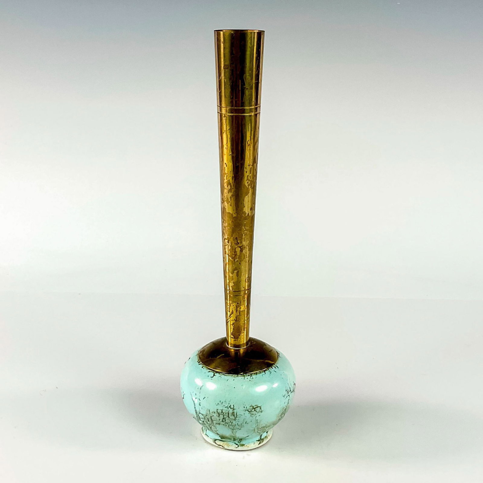 Unusual Delft Mid-Century Modern Lustre Glaze Bud Vase: Turquoise with lustre finish and branch patterning. Round body. Narrow brass spout. Hand Painted Delft Holland on bottom. This item has no reserve. Dimensions: 2.25"W x 8"H Manufacturer: Delft Country