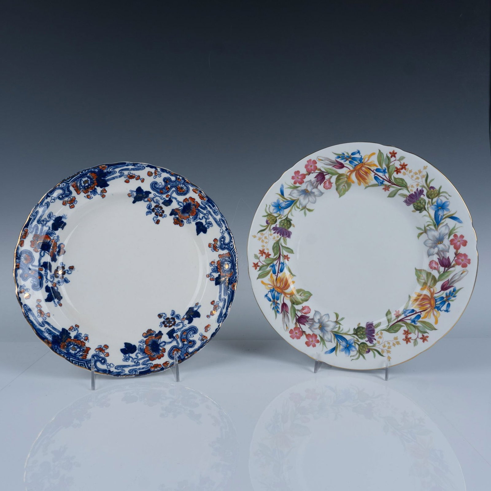 2pc Shelley Bone China and Keeling Plates: Fabulous duo of white plates with floral designs that includes a Shelley Spring Bouquet dinner plate with a Shelley Fine Bone China backstamp 10.75" dia., and a Keeling and Co Tokio Blue dinner plate 