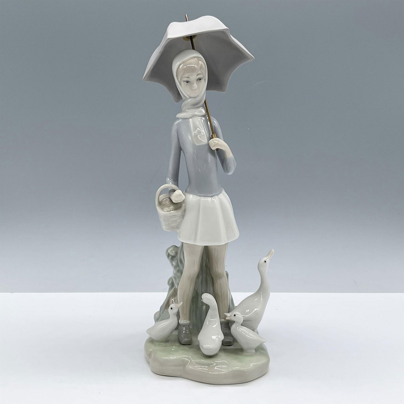 Girl with Umbrella 1004510 - Lladro Porcelain Figurine (1 of 3)