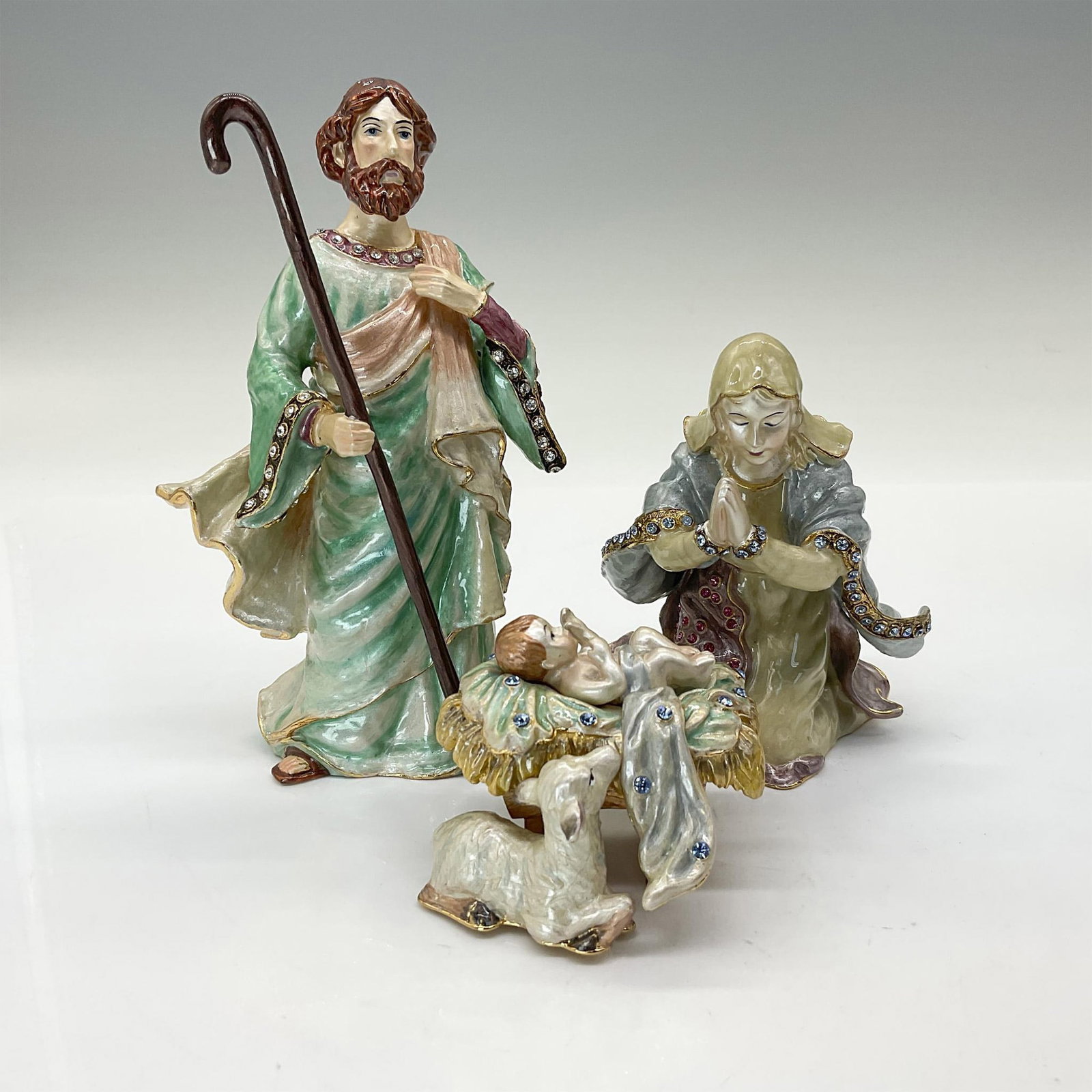 Fitz & Floyd Treasures Collection Holy Family Figurines: Each figure of the Holy Family is hand painted and features exquisite detail. Includes Joseph, Mary, and Baby Jesus. This intricately handcrafted piece features artistic crystals, a rich mosaic of ena