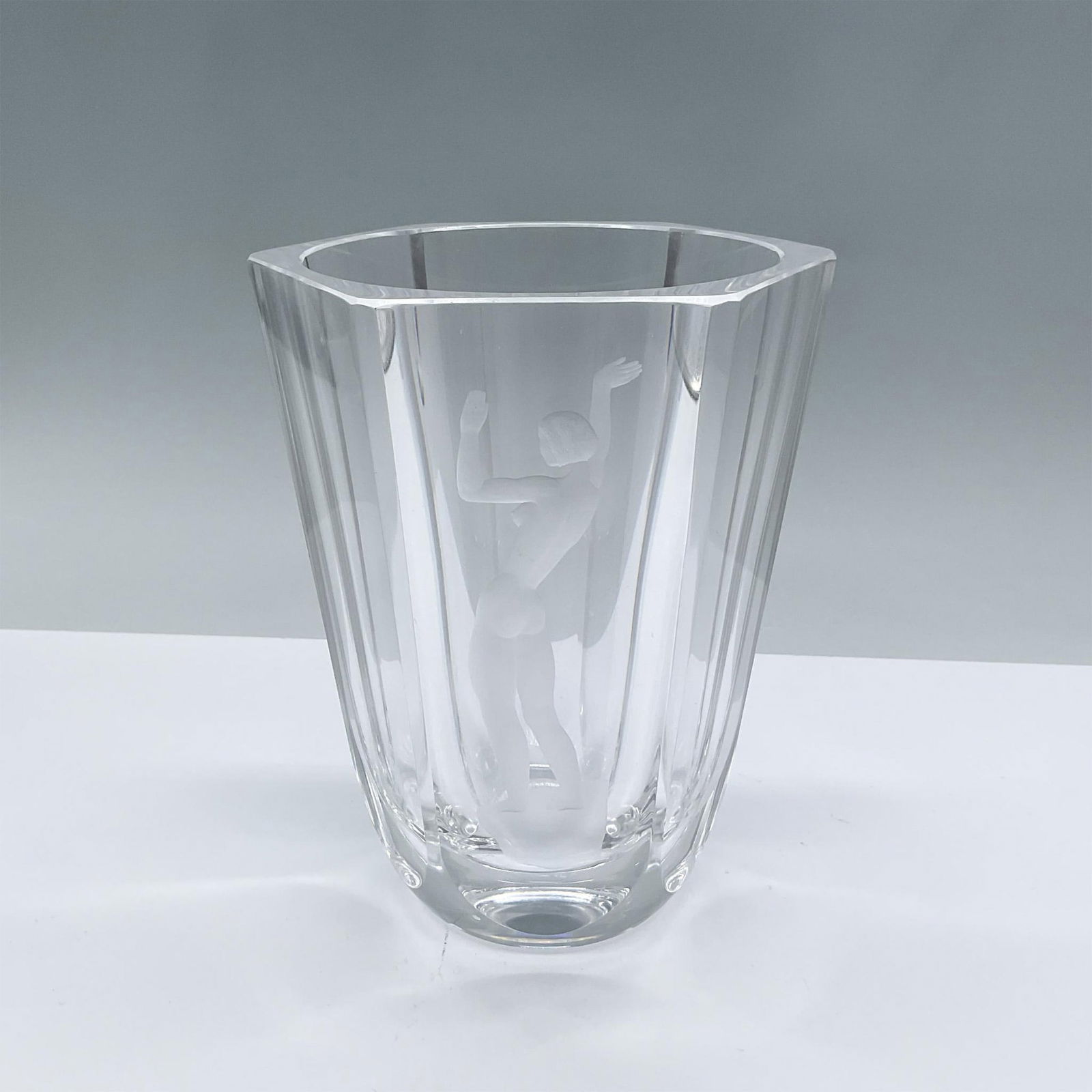 Orrefors Glass Vase: Hexagonal cut glass vase with engraved illustration of nude woman. Orrefors etched mark. Issued: 20th century Dimensions: 6"H x 4.25"dia. Manufacturer: Orrefors Country of Origin: Sweden