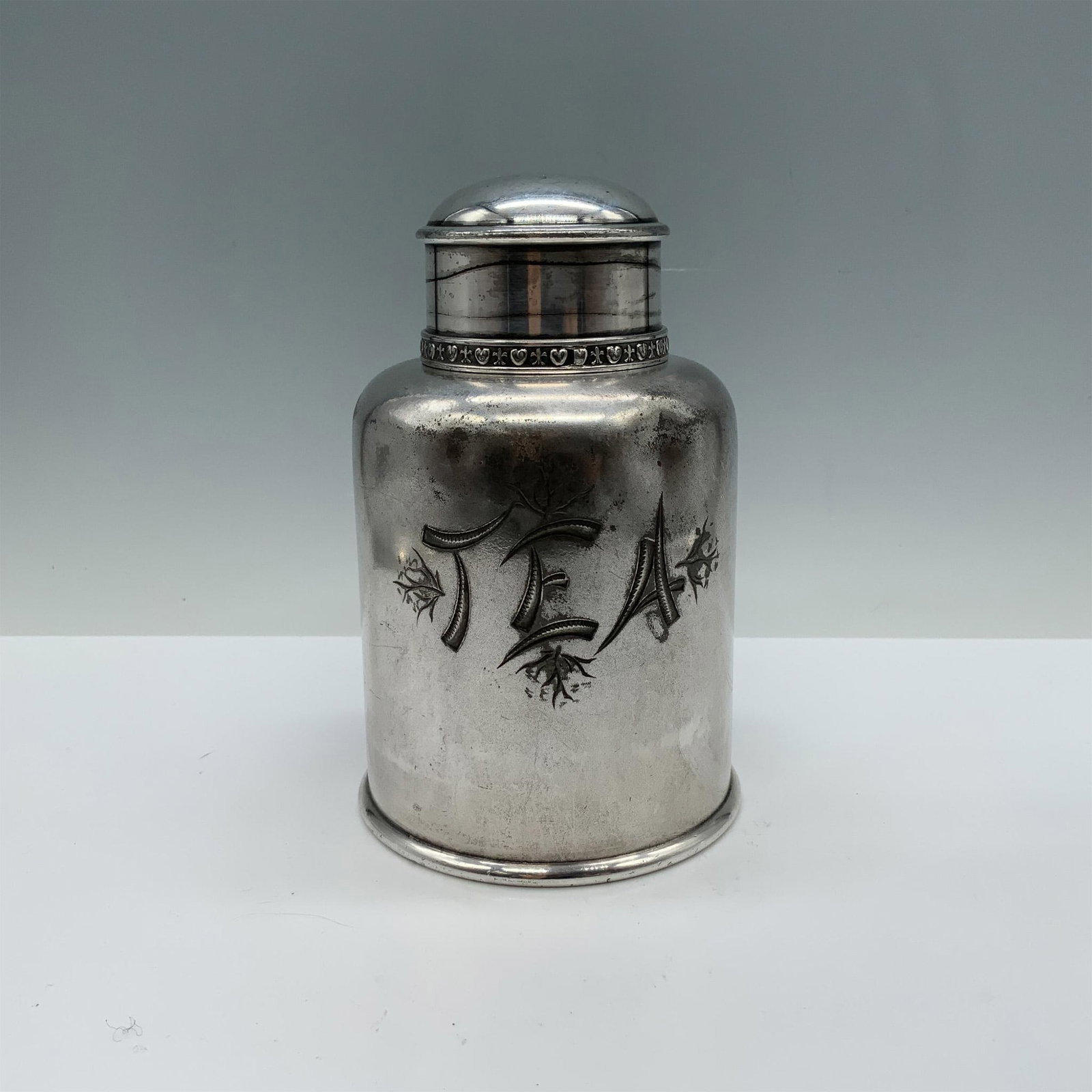 James W. Tufts Quadruple Plate Tea Cannister: Beautifully crafted vintage silverware tea canister that features intricate detailing and a graceful, sturdy design. James W. Tufts Boston Quadruple Plate 2799 backstamp. Issued: 20th century Dimensio