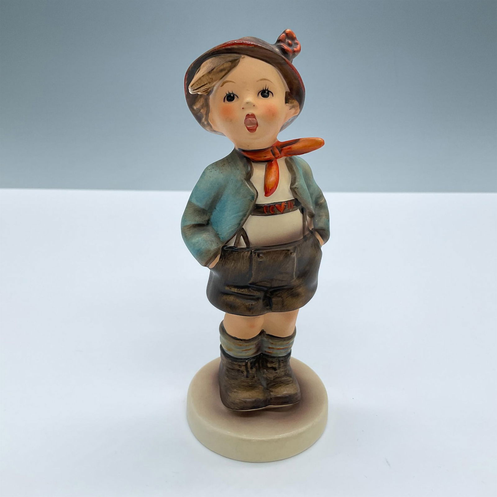 Goebel Hummel Figurine, Brother: Adorable child dressed in traditional clothes with his hands on his pockets. Goebel Hummel backstamp. Artist: M. I. Hummel Issued: 20th century Dimensions: 5.75''H x 2.25''dia Manufacturer: Goebel Hum