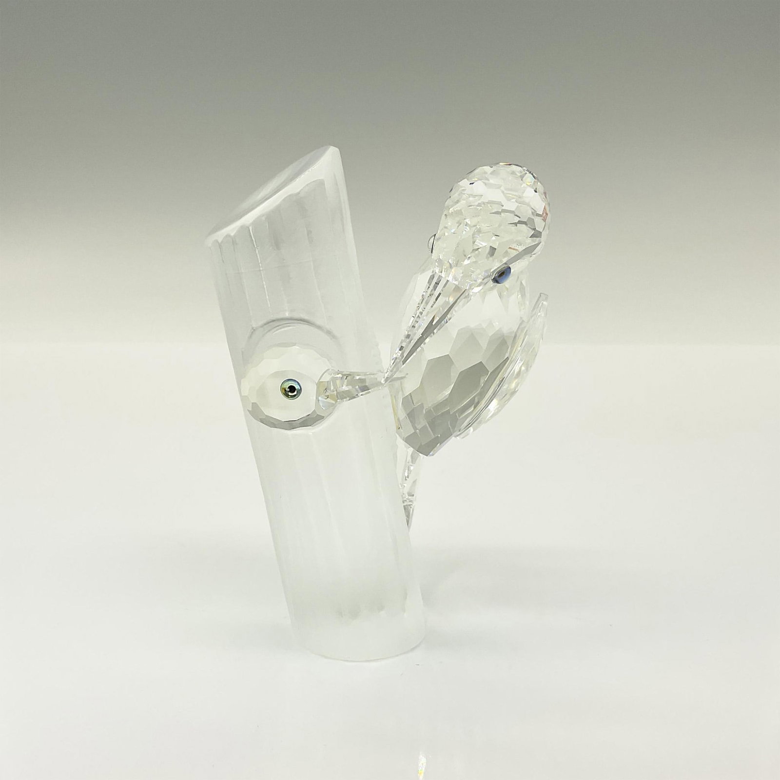 Swarovski Crystal Figurine, Sharing, The Woodpeckers: Brilliant clear crystal SCS Annual Edition figure of a young wood pecker peeking out of a nest in a frosted tree and met by an adult wood pecker. Swarovski etched backstamp on the bottom. This item ha