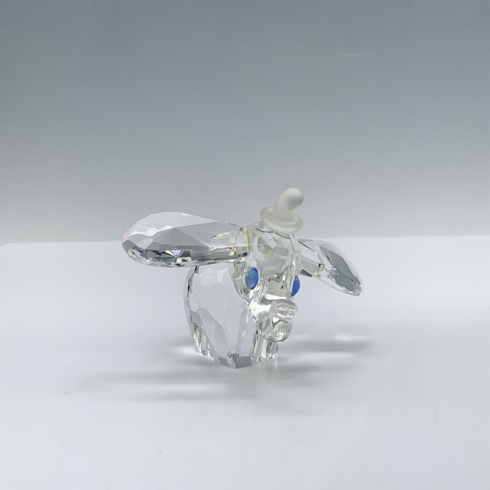 Swarovski Crystal Figurine, 1993 Disney Dumbo: This version of Dumbo 7640 NR 100 001 was available for purchase exclusively in Arribas stores in the Disney Theme Parks. Featuring blue eyes and a frosted hat, this was the first piece to bear both t
