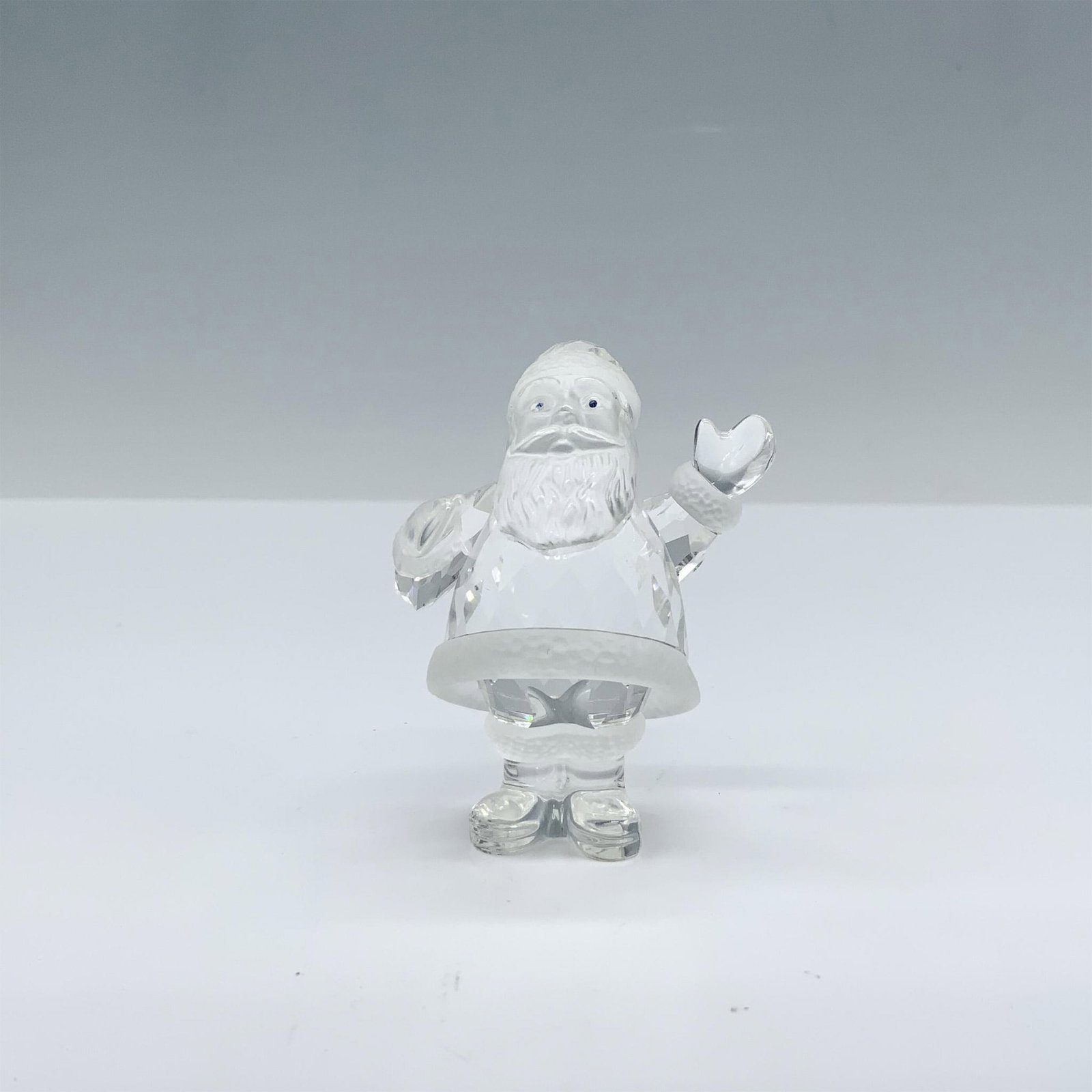 Swarovski Crystal Figurine, Santa Claus: Swarovski crystal Santa Claus that was part of the Exquisite Accents collection and is made from faceted clear and frosted crystal. Swarovski backstamp 221362. Item has its original box which measures