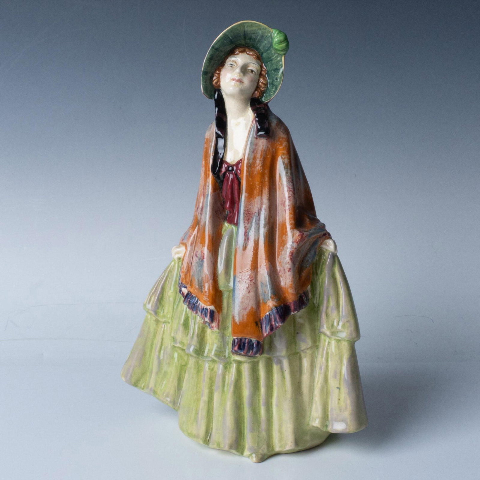 Rhoda - HN1573 - Royal Doulton Figurine: The heroine of British novelist and poet George Meredith's 1865 novel Rhoda Fleming, may have been the inspiration of this lovely earthenware figurine. Royal Doulton backstamp. Artist: Leslie Harradin