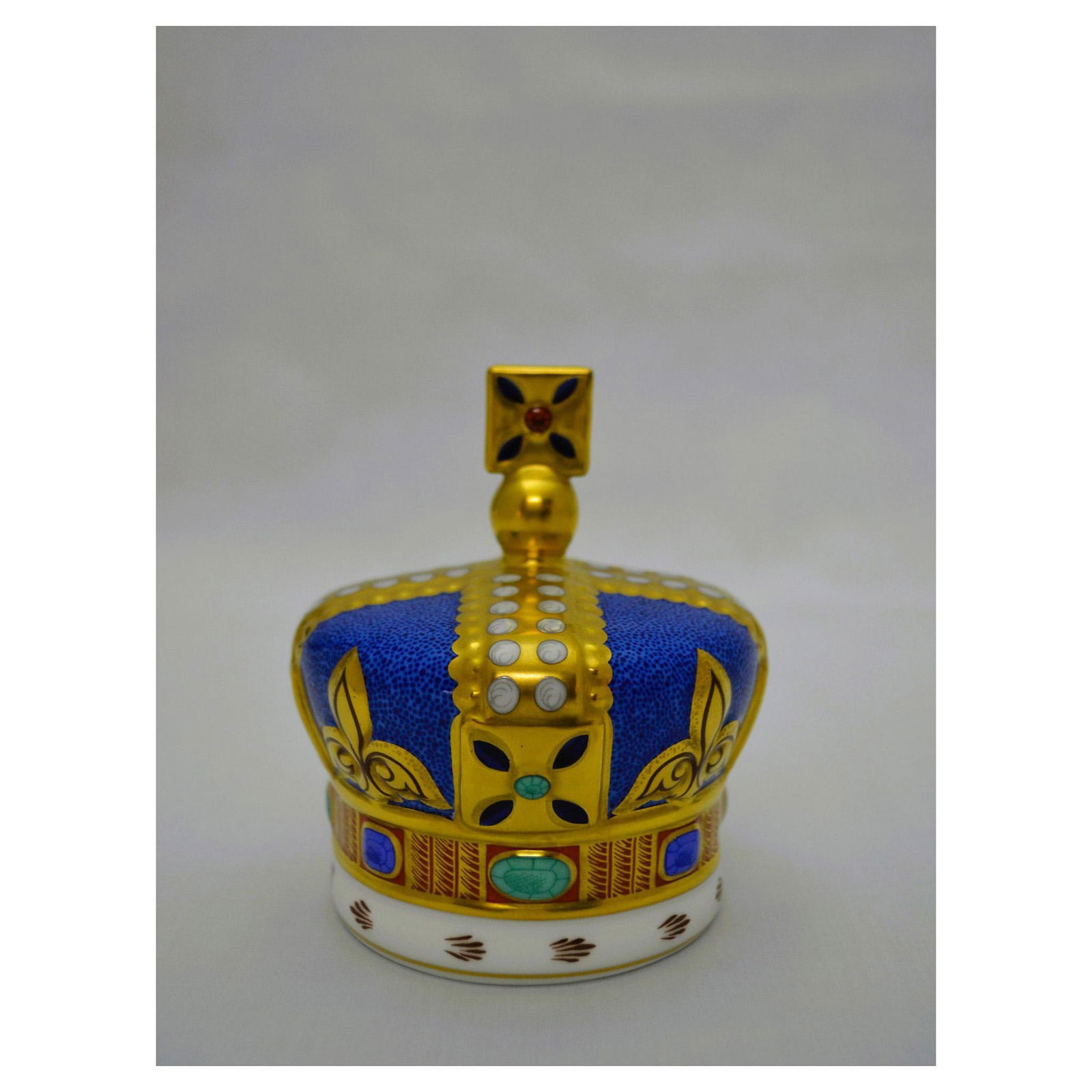 Royal Crown Derby Porcelain 100 Years 1890-1990 Crown Paperweight: English Fine Bone China, Glazed Decorated. Hand created, hand painted, by the Artists of Royal Crown Derby. Featuring the 100 Years 1890-1990 Crown Paperweight, celebrating the Anniversary of Queen Vi