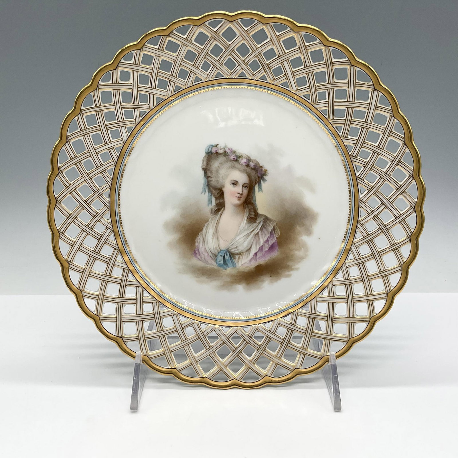 Hand-Painted Porcelain Plate, La Princesse de Lamballe: Reticulated porcelain with gilt border features a finely detailed portrait of La Princesse de Lamballe, a prominent 18th-century French aristocrat and close companion of Queen Marie Antoinette. Signed