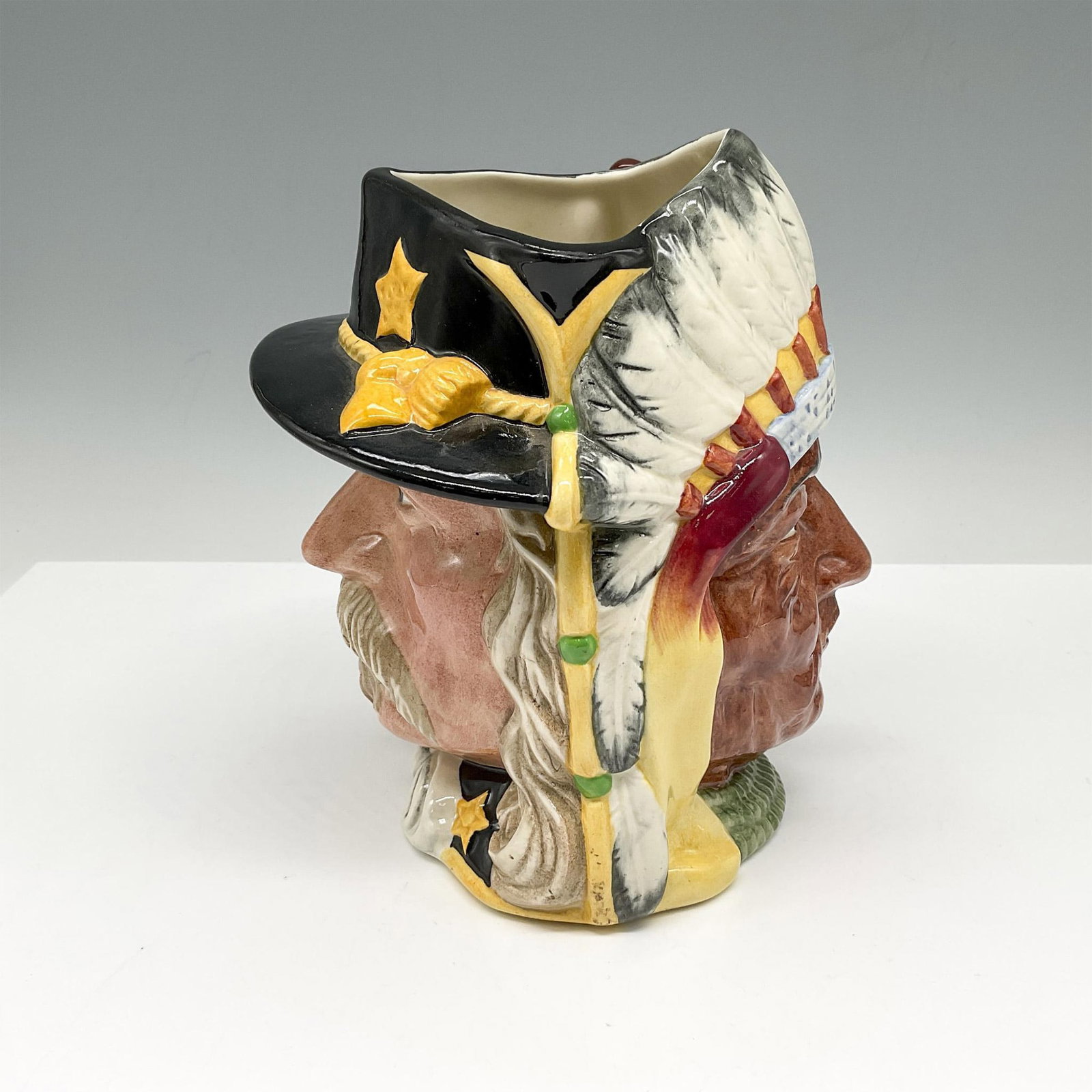 Little Big Horn D6712 Double Face - Large - Royal Doulton Character Jug: The Battle of Little Big Horn 1876: George Armstrong Custer and Sitting Bull (brown eyes). Part of the Antagonists' Collection, and limited edition. Multicolored hand painted figural jug with the hand