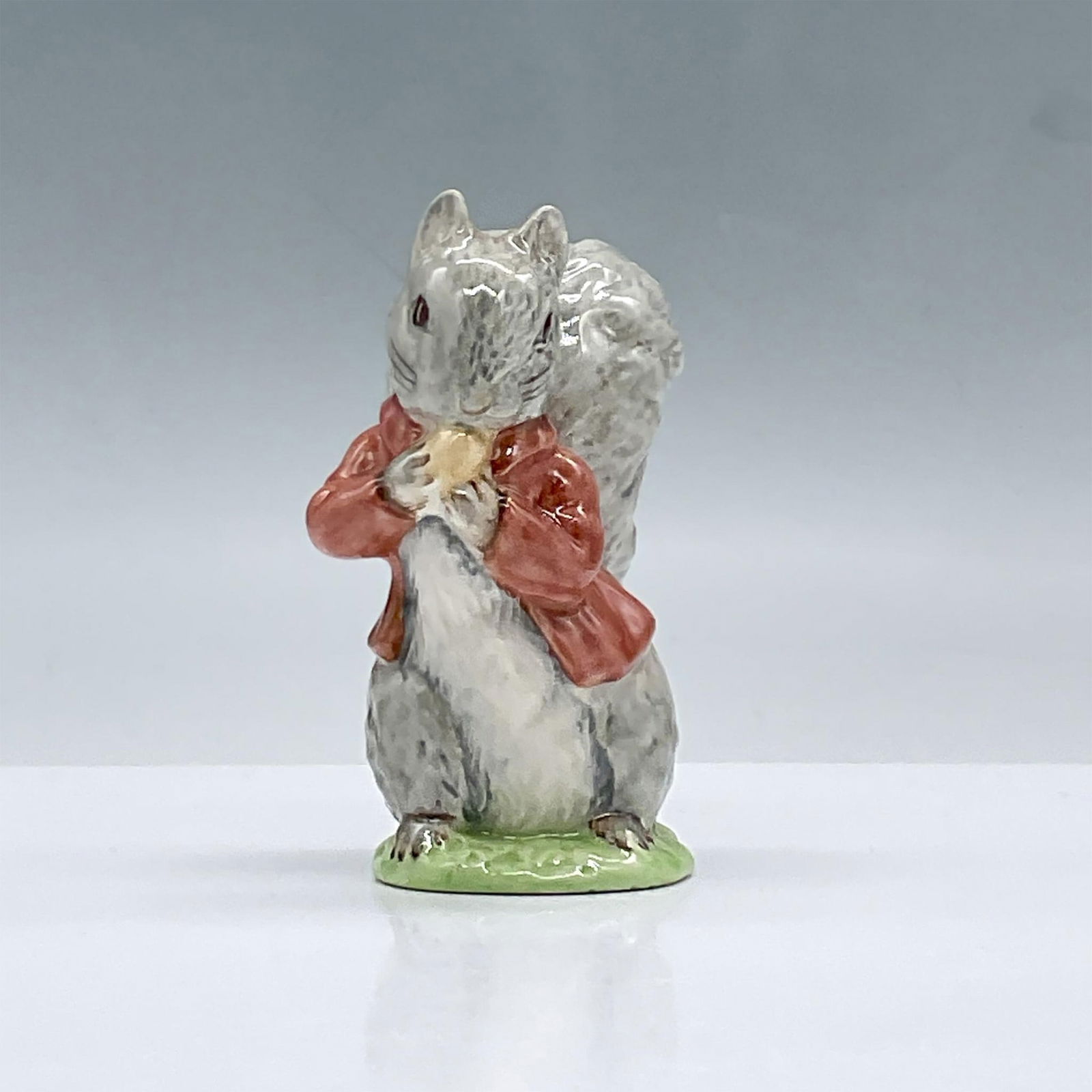 Beswick Beatrix Potter Figurine, Timmy Tiptoes: Glossy porcelain. Features a squirrel eating a nut. Beswick Beatrix Potter backstamp. This item has its original box, dimensions: 3"L x 3"W x 4.25"H. Issued: 1948 Dimensions: 3"L x 2"W x 3.75"H Manufa