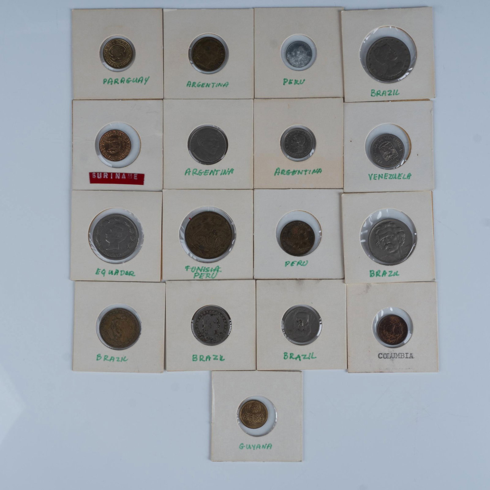 17pc Vintage South American Coins: A collection of 17 coins, 20th century from South America. Various denominations, sizes, metals, and years. Collection includes 1 from Paraguay, 1 from Suriname, 1 from Ecuador, 1 from Guyana, 1 from 