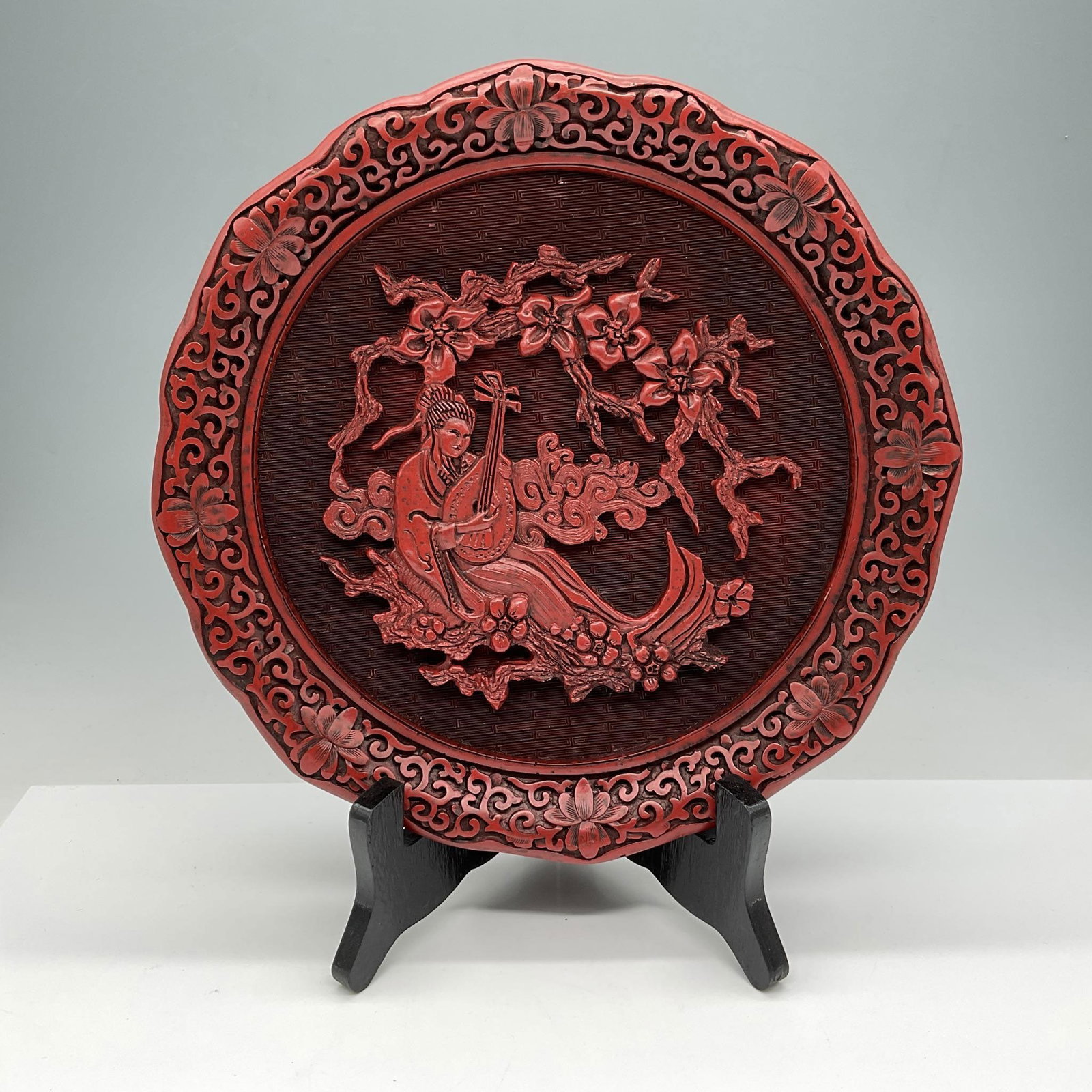 MOA Five Perceptions of Weo Cho Plate The Sense of Hearing: Beautiful depiction of each sense as illustrated on the plate. Curator Ling Fu authenticates this carved Limited Edition cinnabar plate, the fourth in the series, as a work of art in the tradition of 