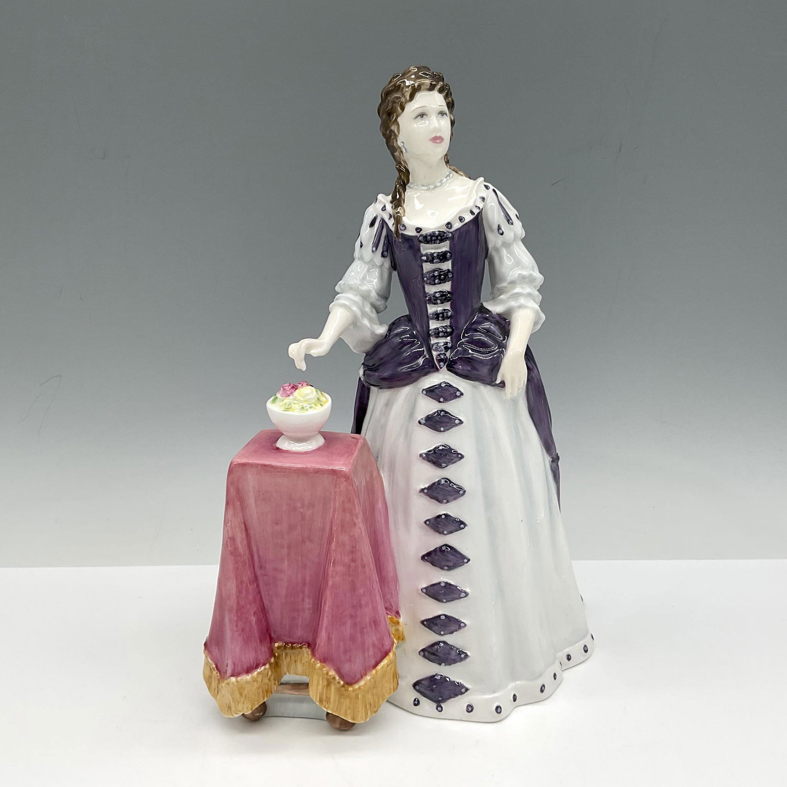 Queen Mary II HN4474 - Royal Doulton Figurine: Limited Edition figure is part of Stuart Queens series, Queen to William III she is designed in purple and white. Royal Doulton backstamp. Artist: Pauline Parsons Issued: c. 2002 Dimensions: 6.5"L x 6