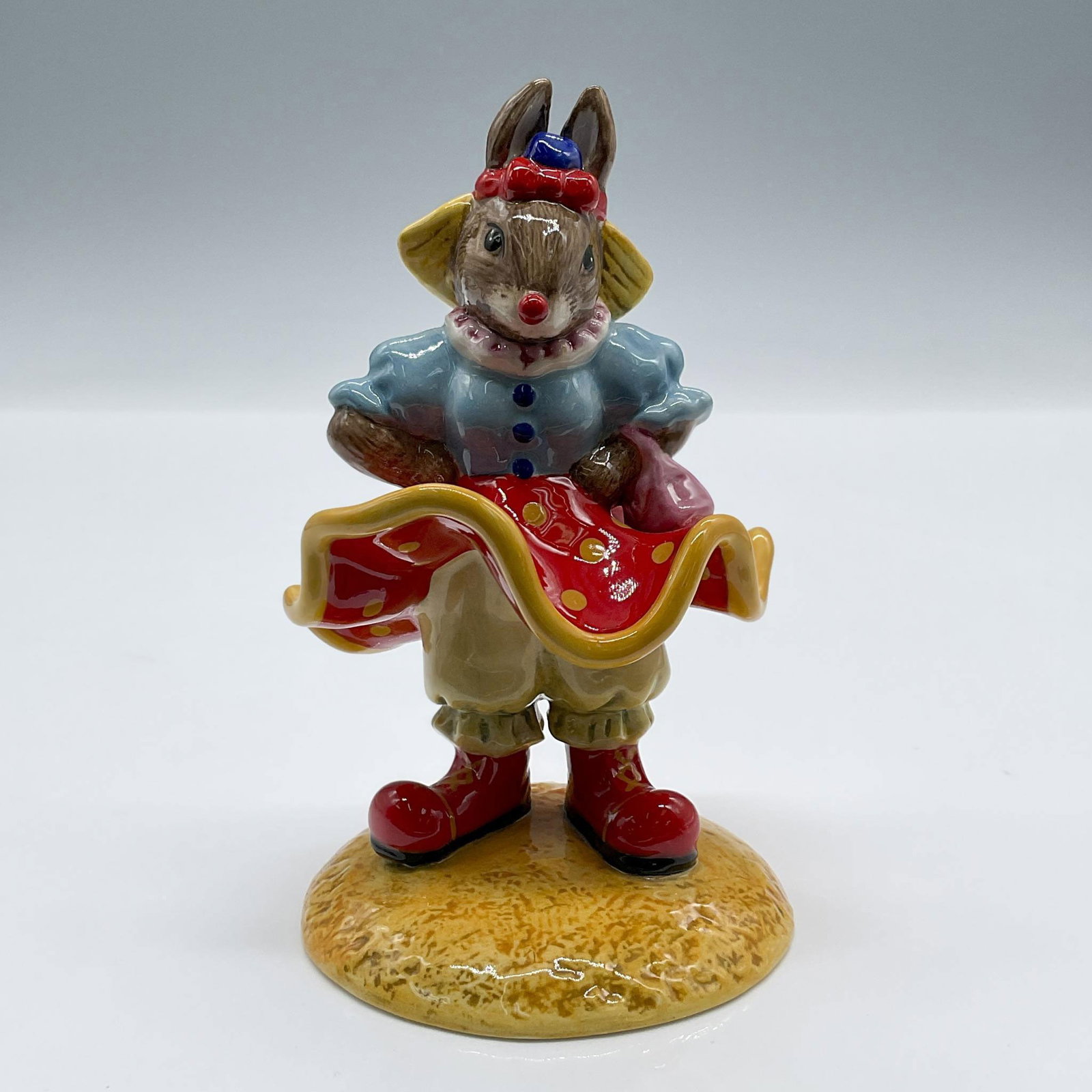 Clarissa The Clown DB331 - Royal Doulton Bunnykins: Exclusive to and celebrating 25 years of the Royal Doulton International Collectors Club. Royal Doulton Bunnykins backstamp. Issued: 2005 Dimensions: 3"L x 2.75"W x 4.5"H Manufacturer: Royal Doulton C