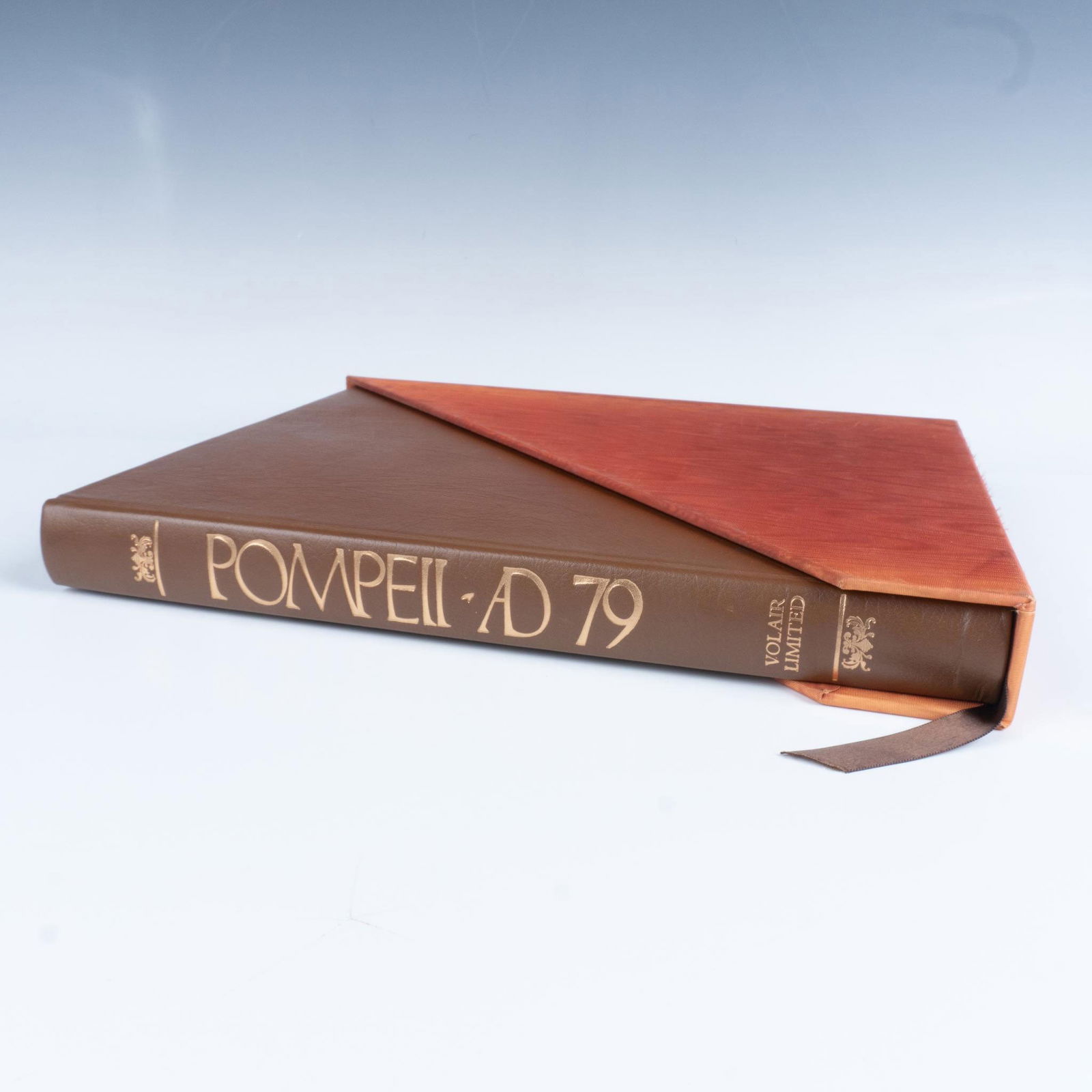 Richard Brilliant Oversize Hardcover Book, Pompeii A.D. 79: Deluxe edition 130 of 2950 of Pompeii A.D. 79: The Treasure of Rediscovery, with original engraving by Arthur Secunda. A large brown leather bond book with a dark brown ribbon bookmark. A perfect book