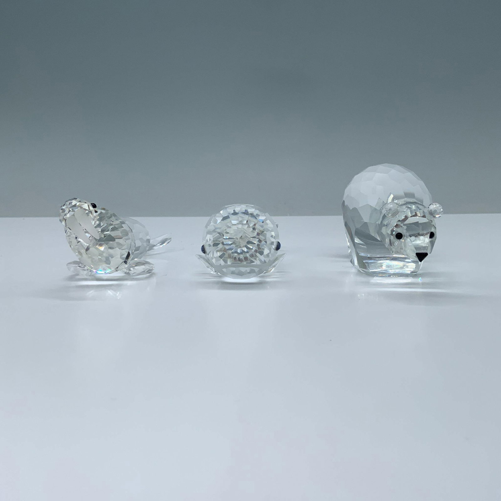 3pc Swarovski Crystal Figurines, Polar Bear, Whale & Walrus: Includes 1 round polar bear standing sturdily with its head held high, showcasing its striking black crystal eyes (013747); measures: 3.5"L x 1.5"W x 1.75"H. 1 clear crystal whale with a pointed tail 