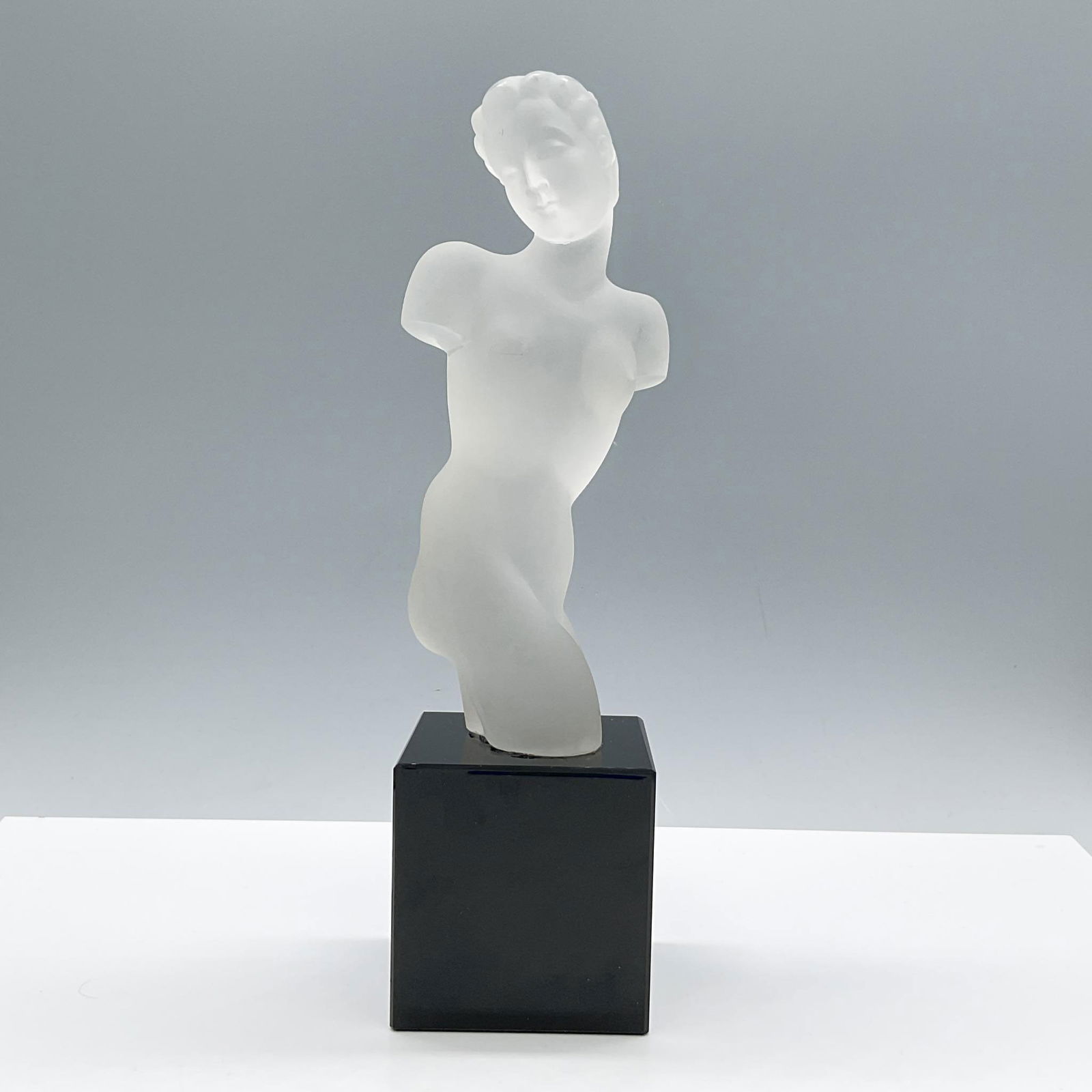 Eleon Von Rommel Glass Nude Torso Sculpture: Gorgeous frosted glass depiction of a Venus. This nude figural piece is mounted on a black block glass base. Artist: Eleonore Von Rommel (German, 1894 - 1974) Issued: c. 1934 Dimensions: 3.25''L x 3.2